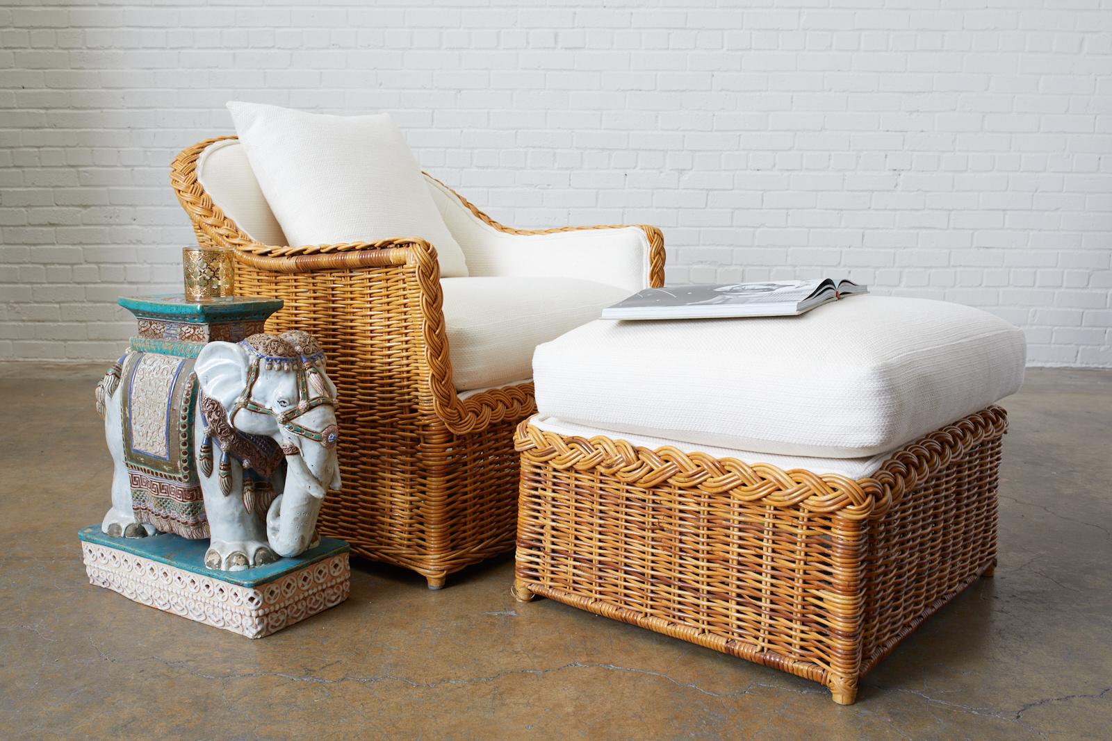 California organic modern style rattan wicker lounge chair and ottoman by McGuire. Constructed with rattan frames covered with wicker having braided arms and trim. The chair is well made with a waisted hour glass form. The matching ottoman measures