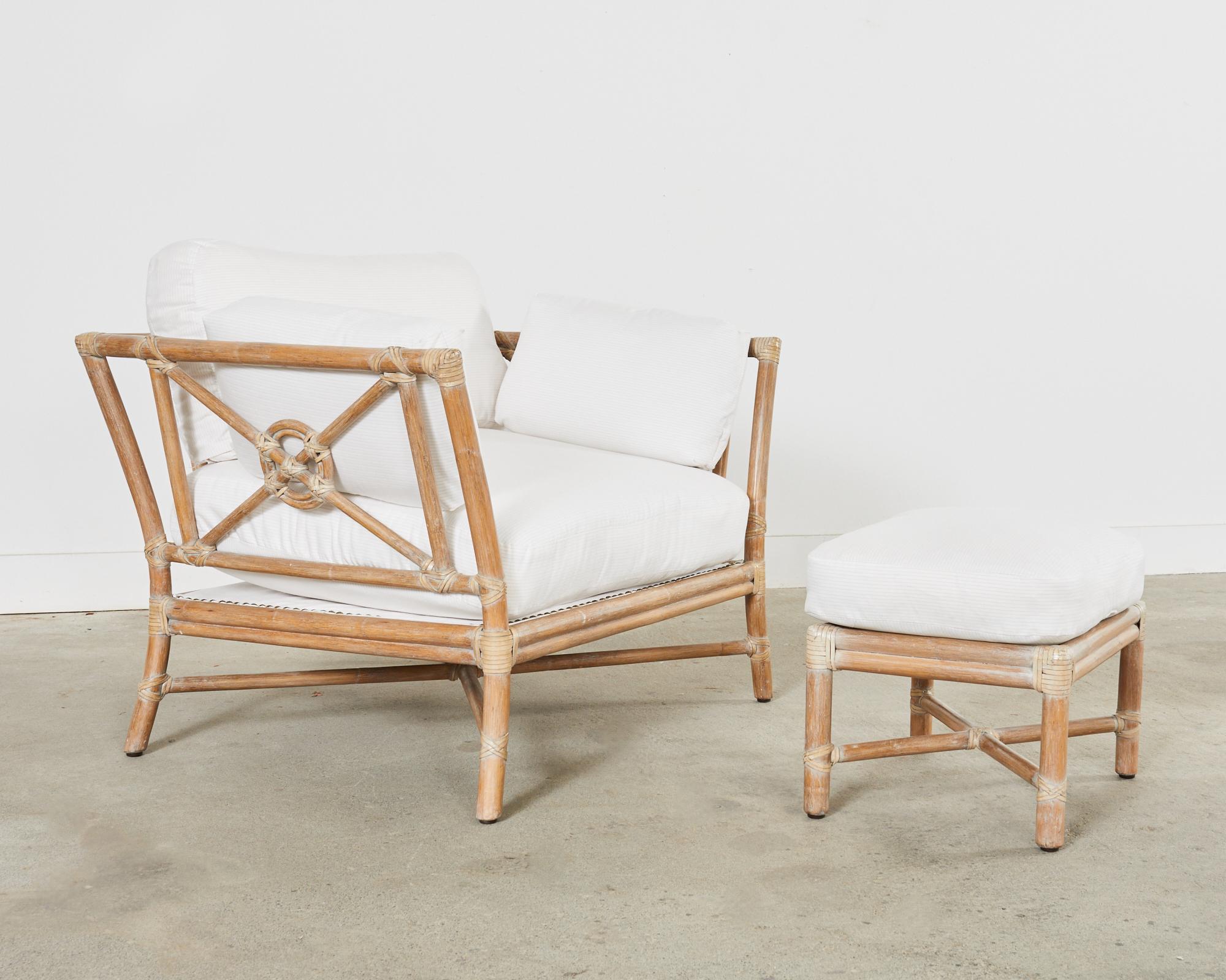 Oversized McGuire rattan lounge chair or club chair with matching ottoman featuring the iconic target design by Elinor McGuire. Made in the fabulous California coastal organic modern style featuring a subtle cerused or glazed finish on the rattan.