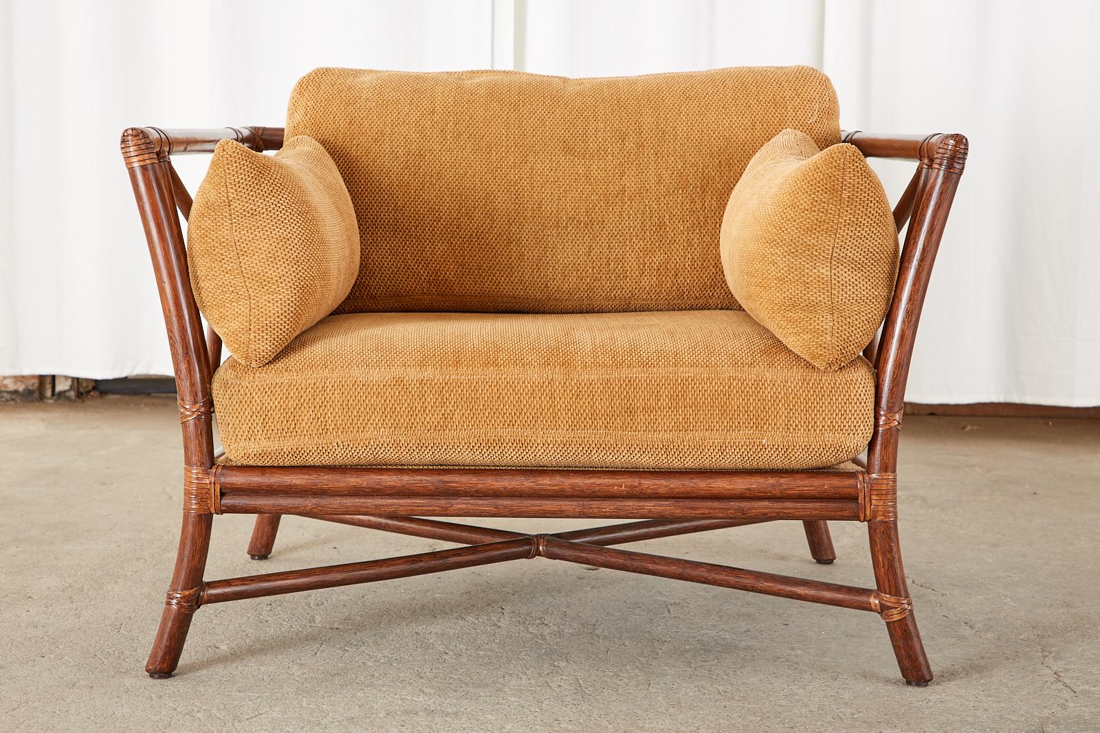 Rare, large cube chair crafted from rattan in the California organic modern style by McGuire. The lounge chair features a target motif designed by Elinor McGuire that has become an iconic McGuire design. The rattan frame is made on a large scale an