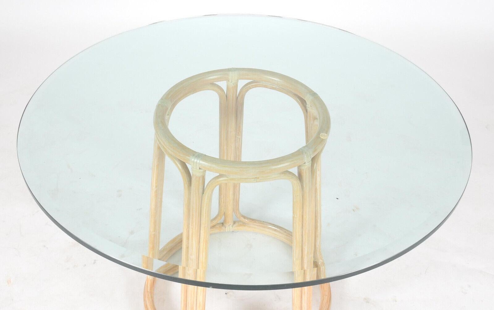 Designed for a glass top, this rattan pedestal dining table base is marked McGuire San Francisco and has the original cerused washed finish. The organic modern base is constructed of bent rattan and features McGuire's signature rawhide lacing. A
