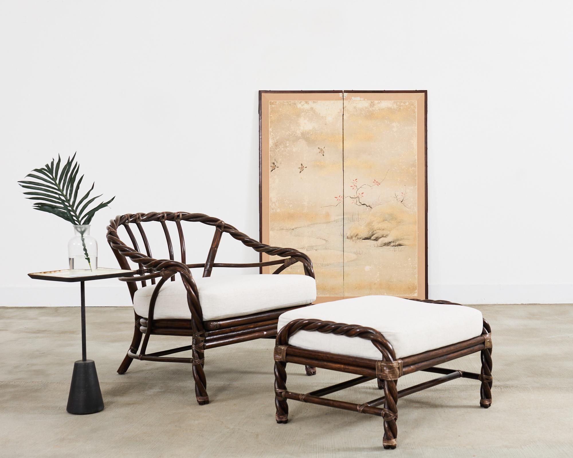 Handsome matching lounge chair and ottoman crafted in the California coastal organic modern style by McGuire artisans. The iconic chair features bent rattan poles twisted together resembling rope. The gracefully curved back and arms have fitted