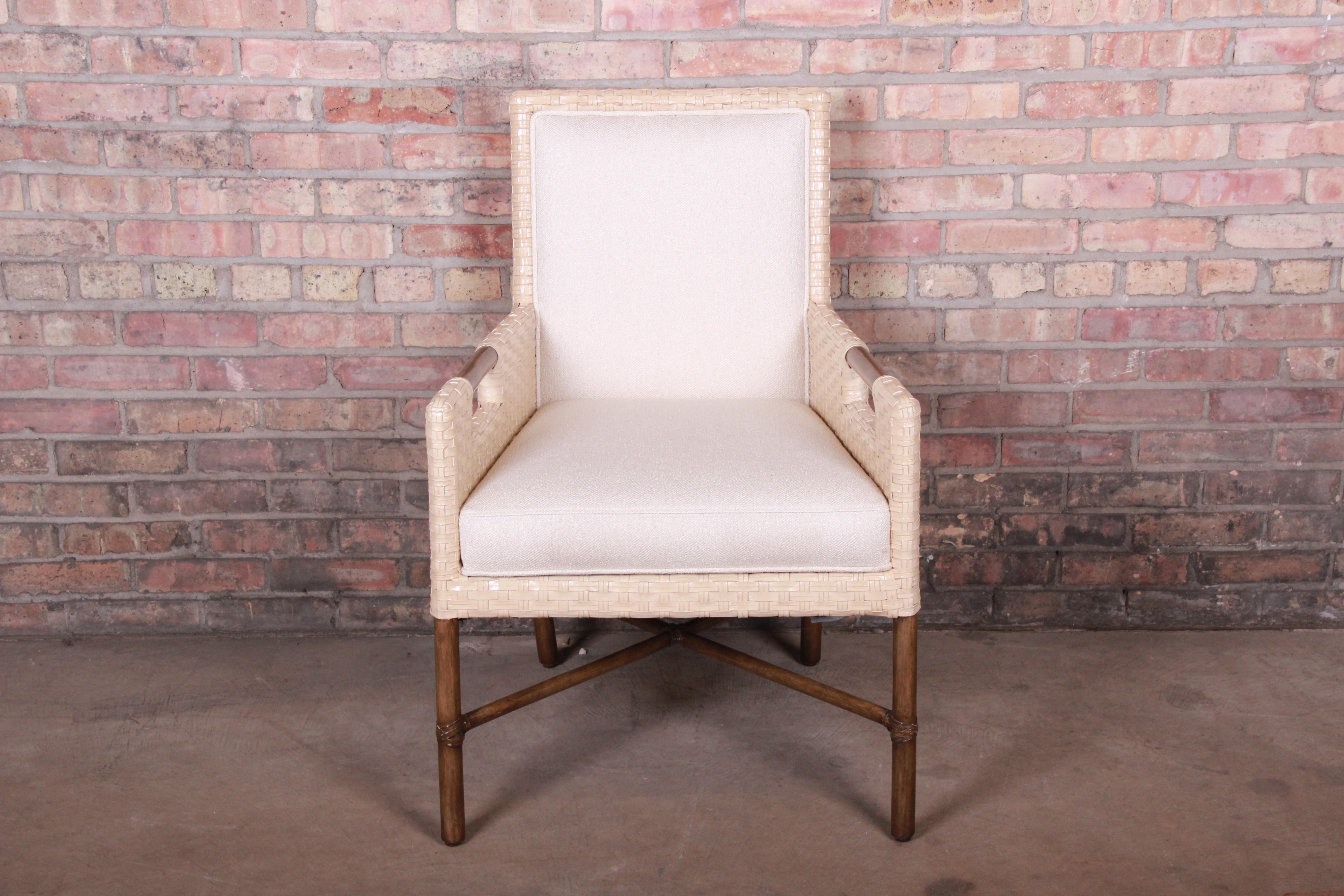 An exceptional organic modern X-base lounge or club chair

By McGuire

USA, circa 1990s

Woven bamboo rattan, with hardwood frame and ivory upholstery.

Measures: 25.75