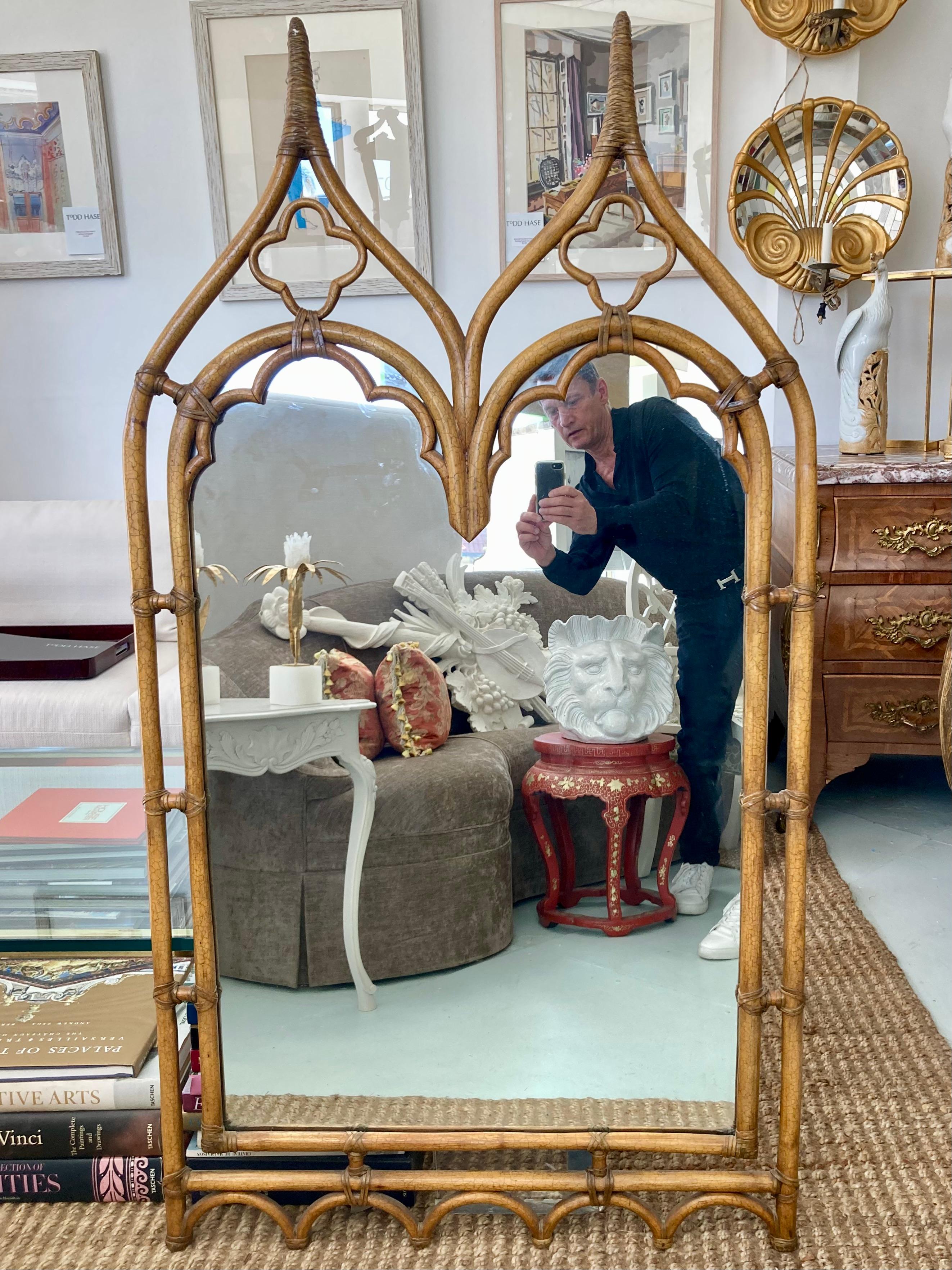Beautiful McGuire rattan gothic mirror. This item has the McGuire seal in the rear. Beautiful quality details and natural leather joints and wrapping.