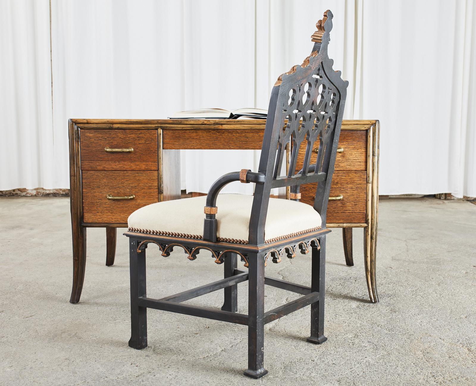 Mid-Century Modern rattan and oak knee hole writing table or desk designed by Eleanor Forbes for McGuire. Classic styling featuring an oak hardwood case with split rattan trim. Fronted by five storage drawers with shaped brass pulls. Supported by