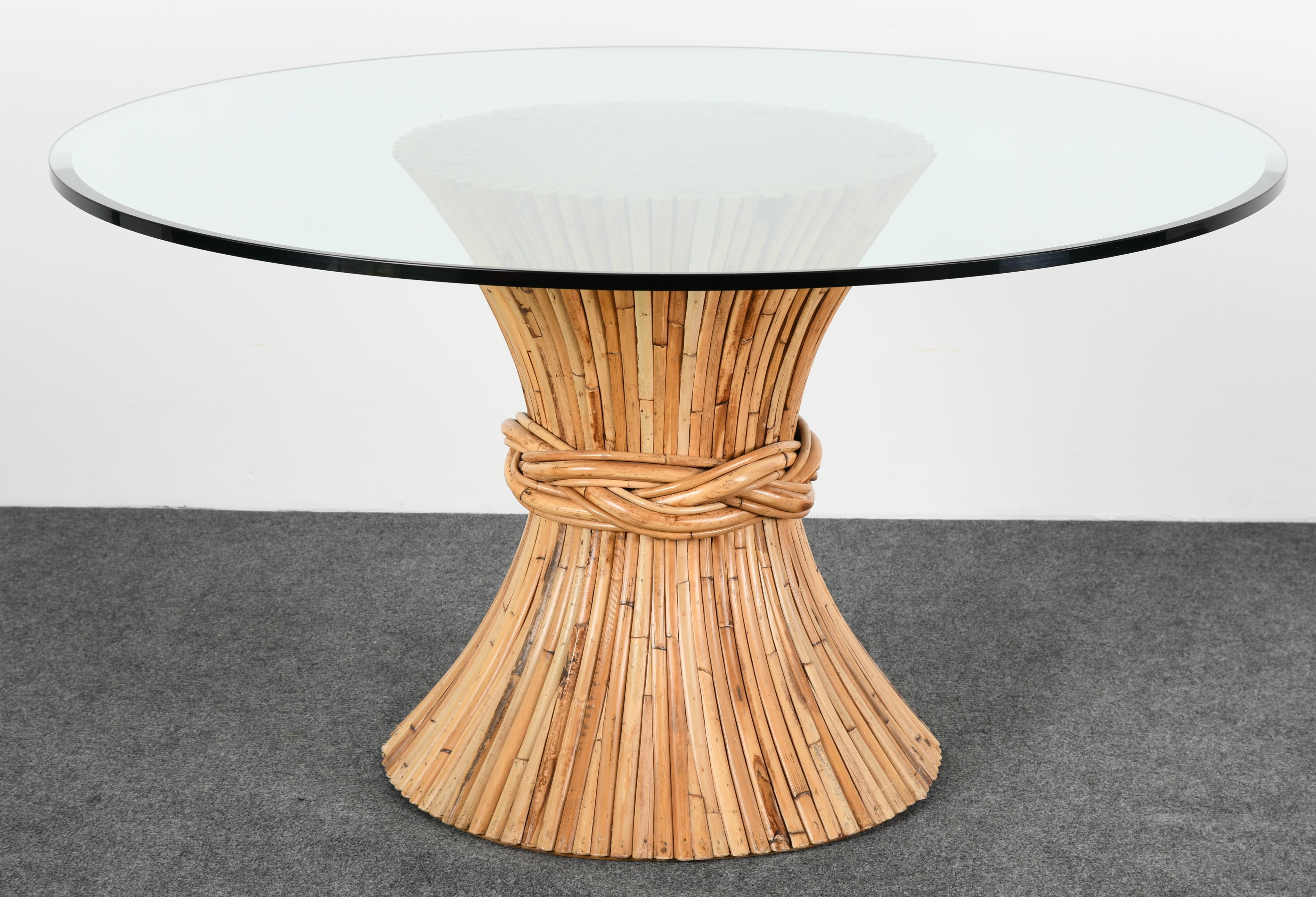 A bamboo dining table base designed by John and Elinor McGuire for McGuire Furniture Company. Beautiful natural coloring and texture. McGuire tag underside. Very good vintage condition with age appropriate wear. Glass not available. 

Dimensions
