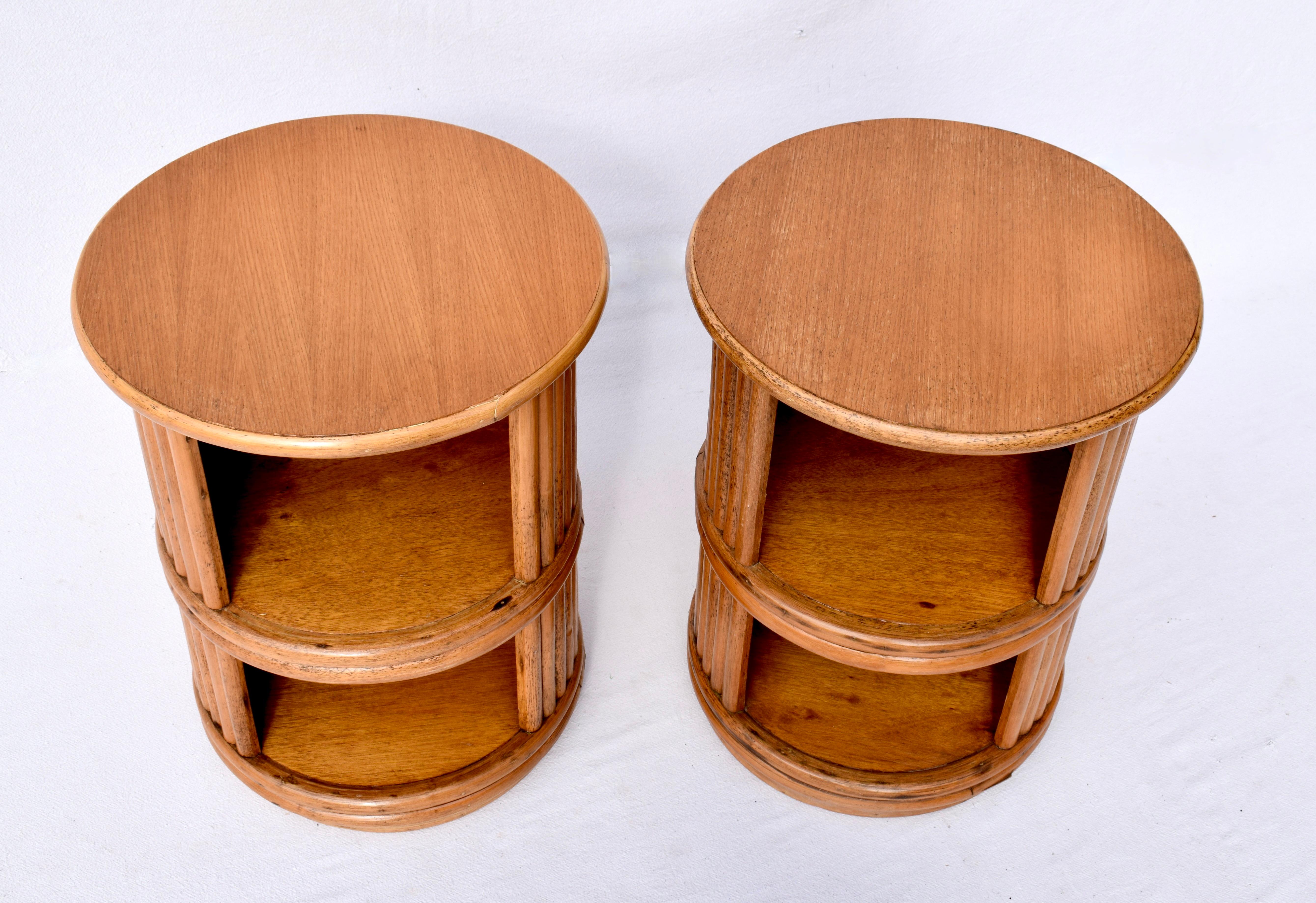 A pair of 1960's Oak & Bamboo two tier swivel side tables by Mcguire San Francisco with refinished tops & original Mcguire Brass tags.