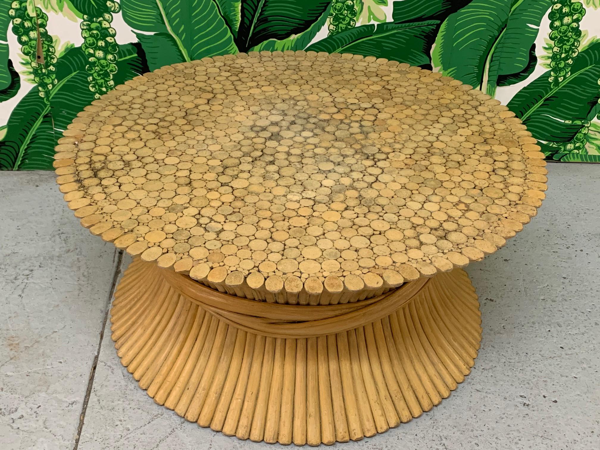 Vintage McGuire sheaf of wheat coffee or cocktail table features iconic bound rattan design. Good vintage condition with minor imperfections consistent with age. Unmarked.