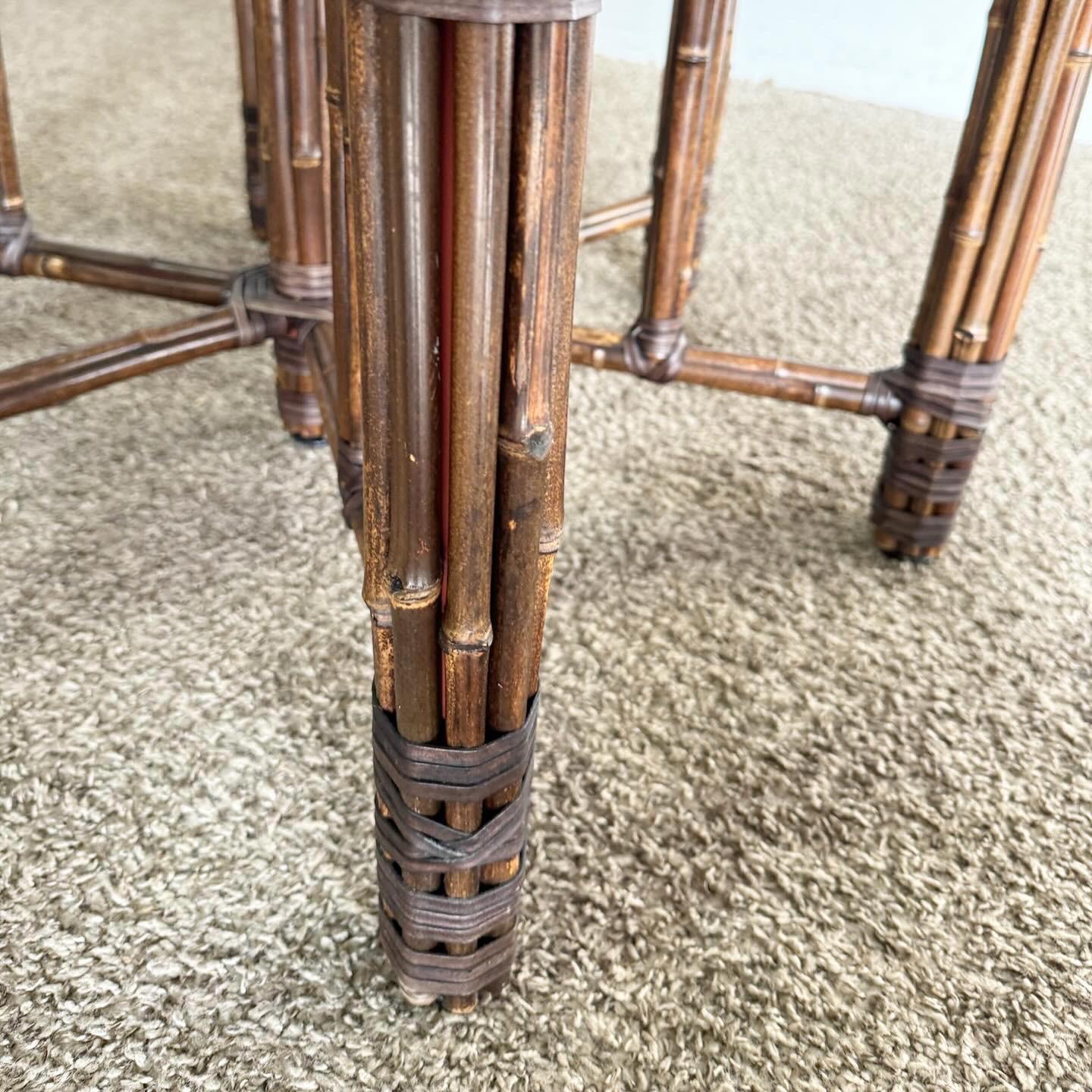 The McGuire Style Boho Chic Bamboo Rattan Dining Table Base is an exquisite addition to any dining area. Inspired by McGuire's iconic design, it showcases the natural beauty and craftsmanship of bamboo and rattan. This sturdy base adds a warm,