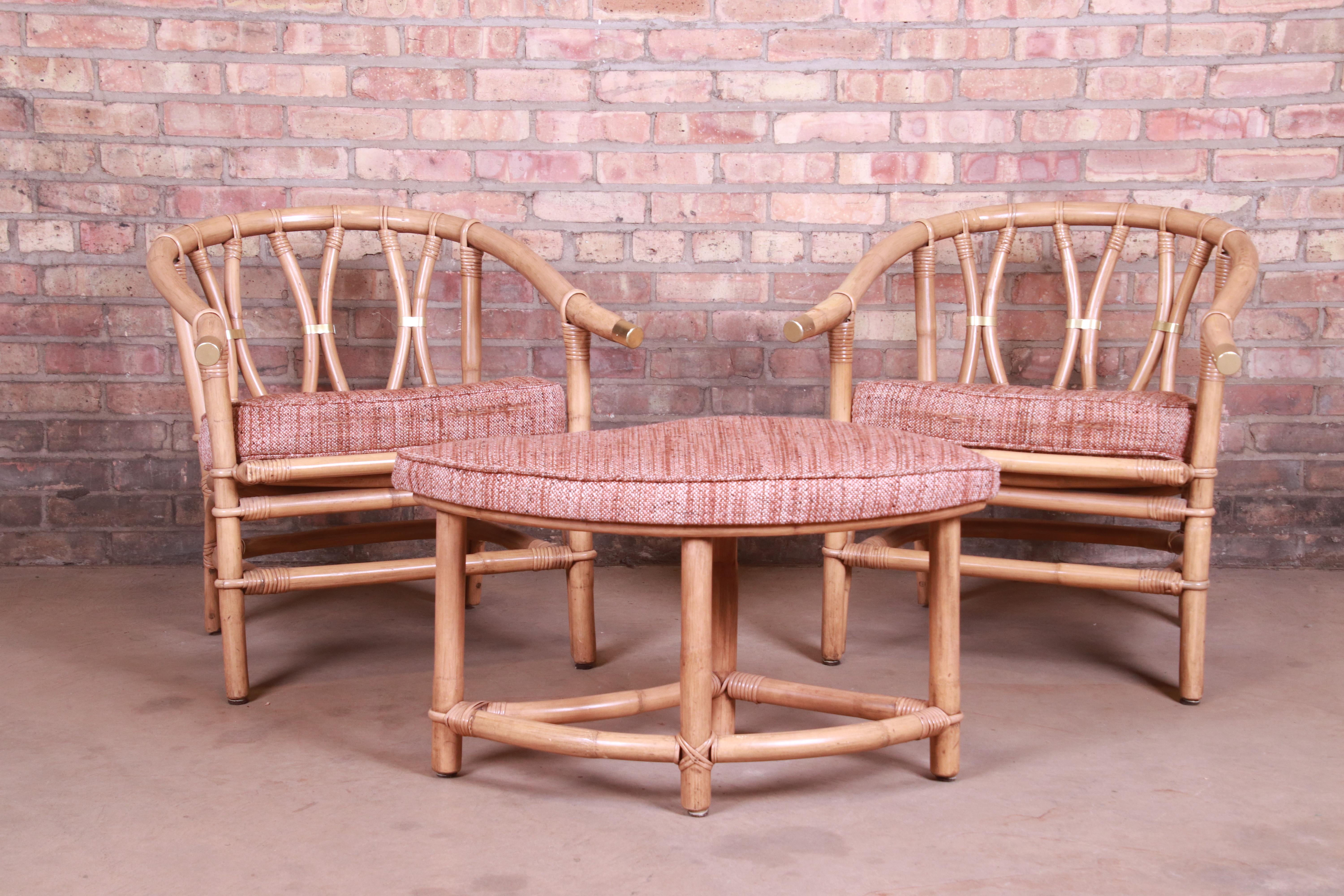 A gorgeous pair of midcentury organic modern Hollywood Regency lounge chairs with ottoman

In the manner of McGuire

USA, circa 1960s

Bamboo and rattan, with brass accents and upholstered seats.

Measures: 25.88
