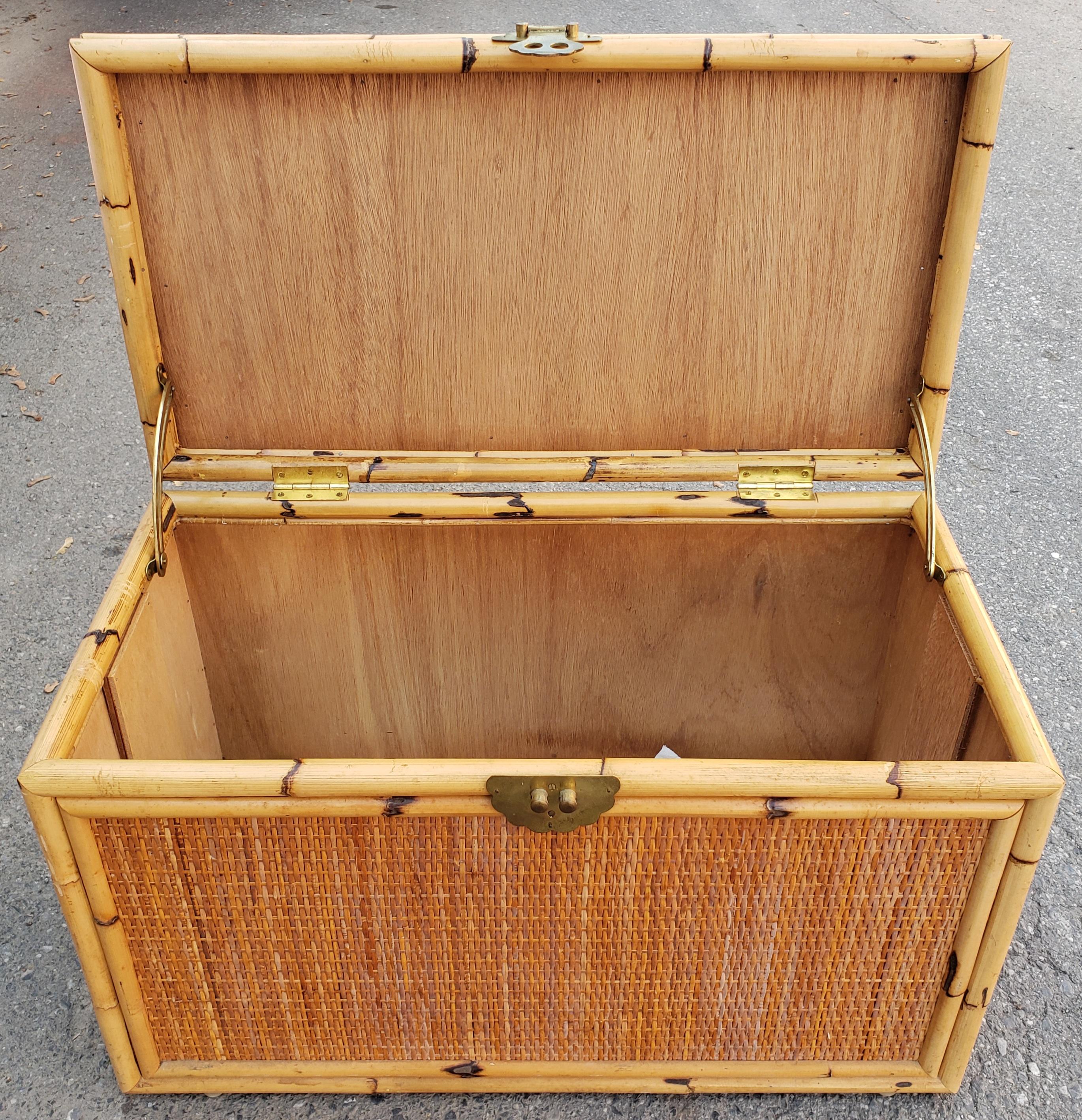 McGuire style chinoiseries woven rattan bamboo wicker trunk in nice as found vintage condition. Minor wear and imperfections to the handmade trunk.
Great looking piece for a nice textural touch to your decor. Would be a perfect coffee table size