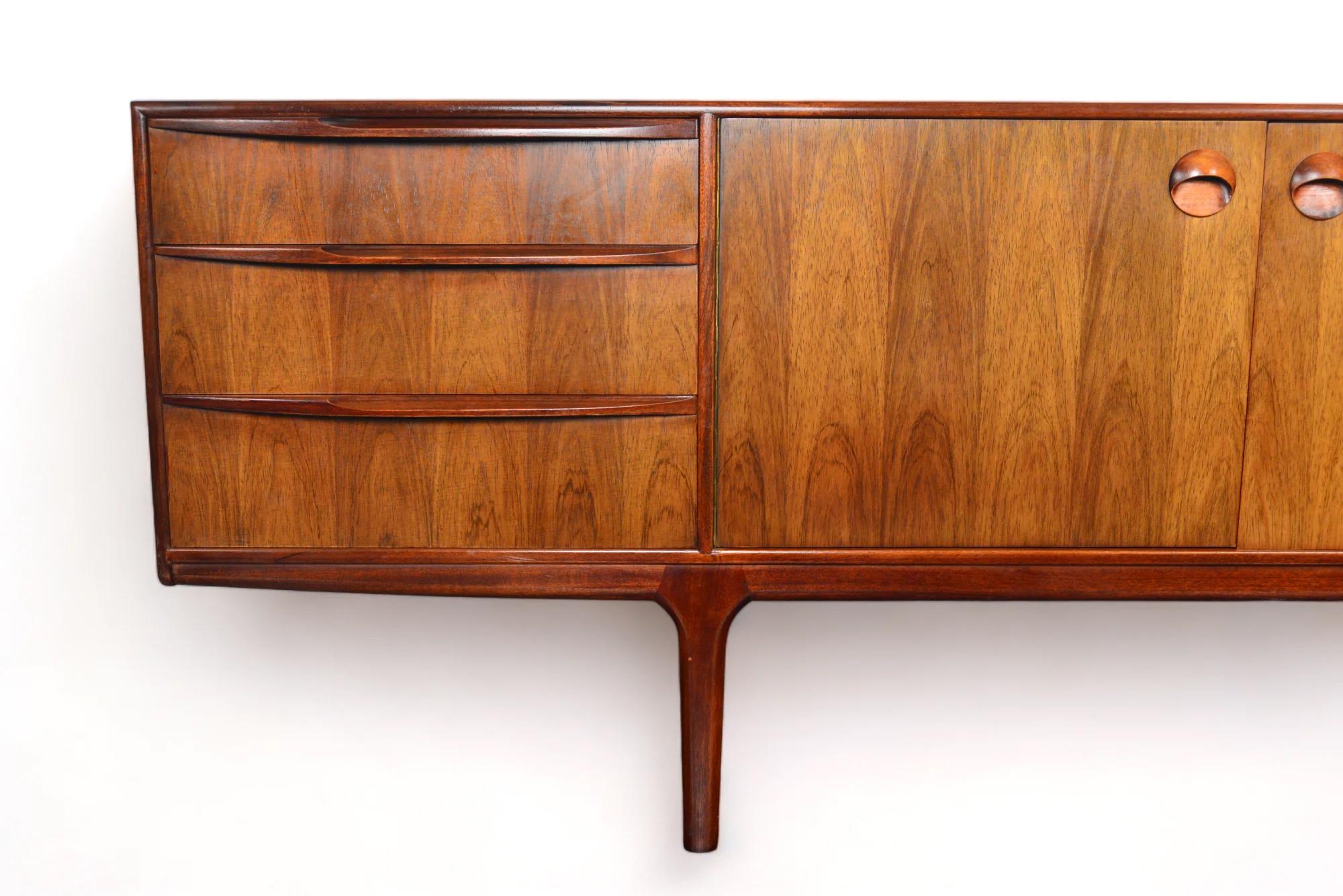Origin: Scotland
Designer: Val Rossi
Manufacturer: A.H. McIntosh
Era: 1960s
Materials: Rosewood
Measurements: 84″ wide x 18″ deep x 30″ tall
Condition: In excellent original condition with typical wear for its vintage

Price includes restoration /