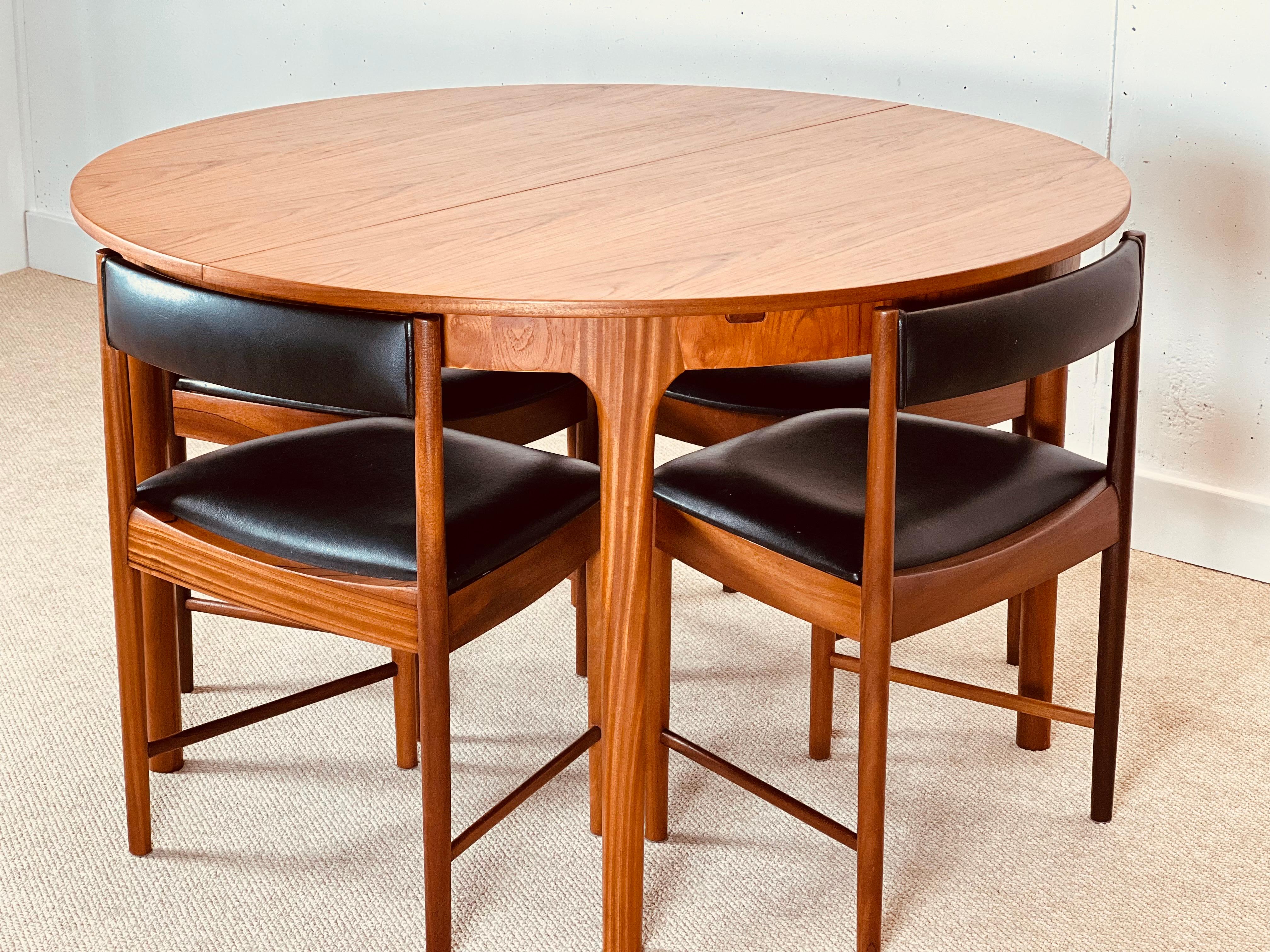 McIntosh Round Extending Teak Dining Table and Chairs in Black Vinyl 6