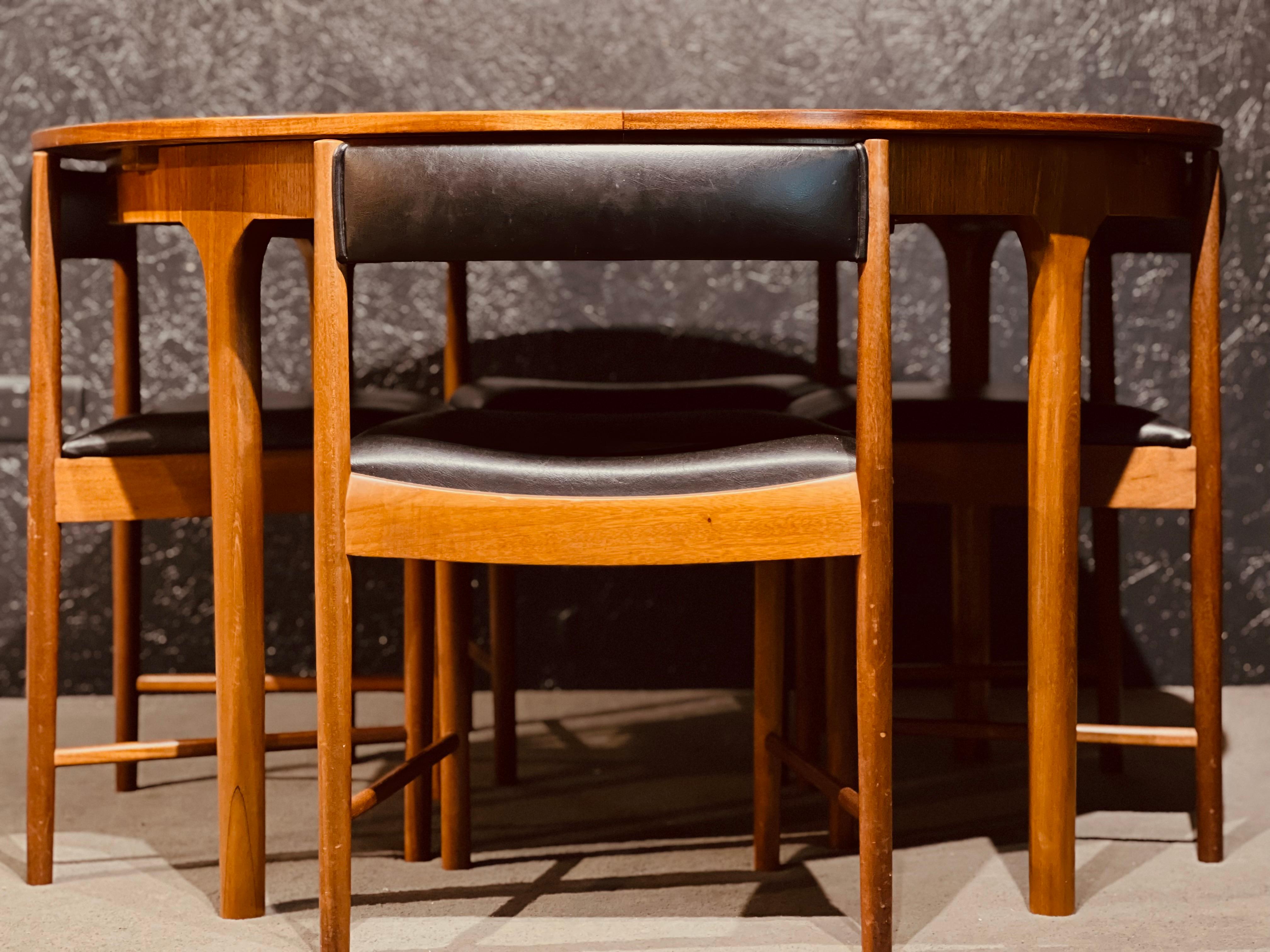 Mid-Century Modern McIntosh Round Extending Teak Dining Table and Chairs in Black Vinyl