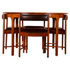 McIntosh Round Extending Teak Dining Table and Chairs in Black Vinyl