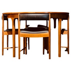 Retro McIntosh Round Extending Teak Dining Table and Chairs in Black Vinyl