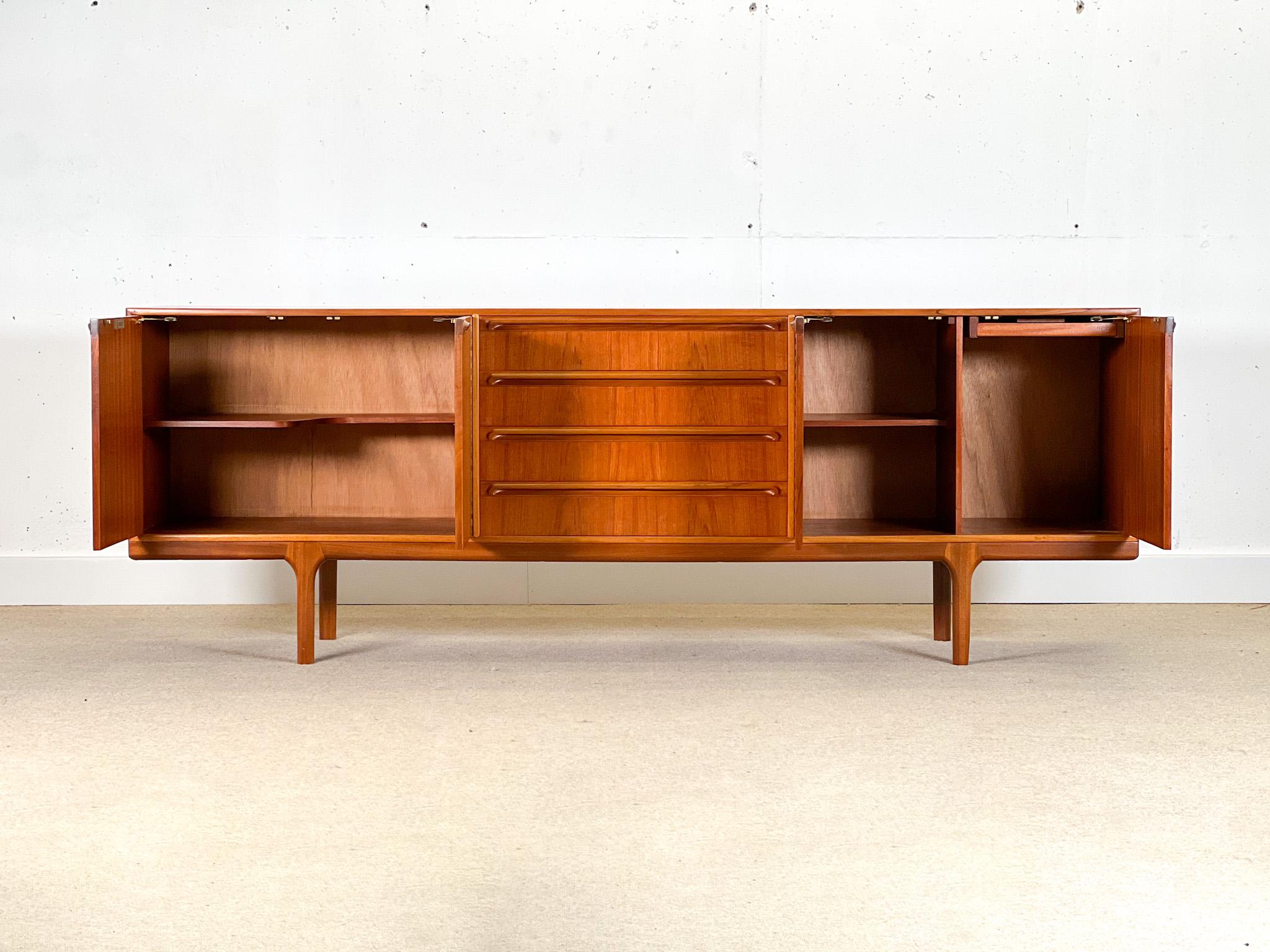 Designed by Tom Robertson for A.H McIntosh and Co., it was made in the 1960s in Scotland.

This Mid-Century piece stands out for its balanced design, designed to create symmetry.

This sideboard has a large storage capacity, with four central