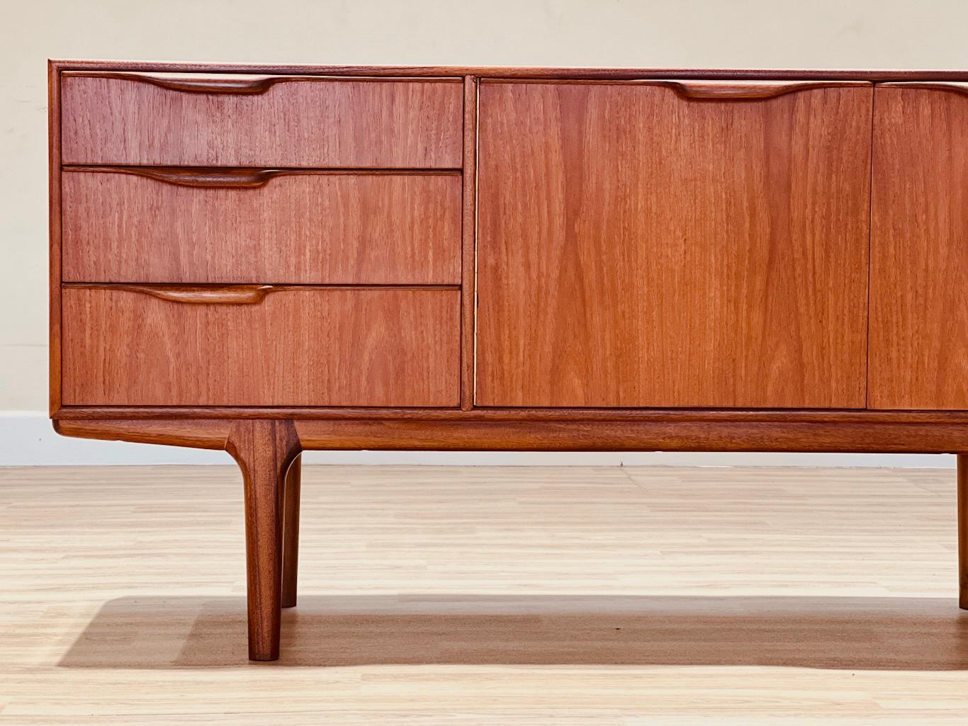 Stunning teak sideboard designed by Tom Robertson for AH McIntosh, included in the Moy collection; collection edited with pieces for small rooms.

This sideboard is similar to the Dunvegan model but with smaller proportions.

Measures

154 x 45