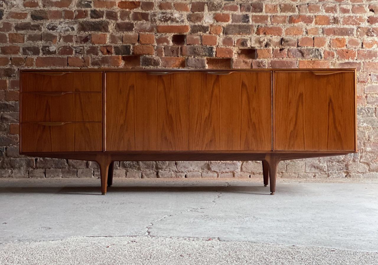 McIntosh teak sideboard credenza by Tom Robertson for A.H McIntosh, circa 1960s

A stunning midcentury design Teak sideboard designed by Tom Robertson for AH McIntosh of Kirkcaldy, Scotland, circa 1960s, the beautiful rectangular top with stunning