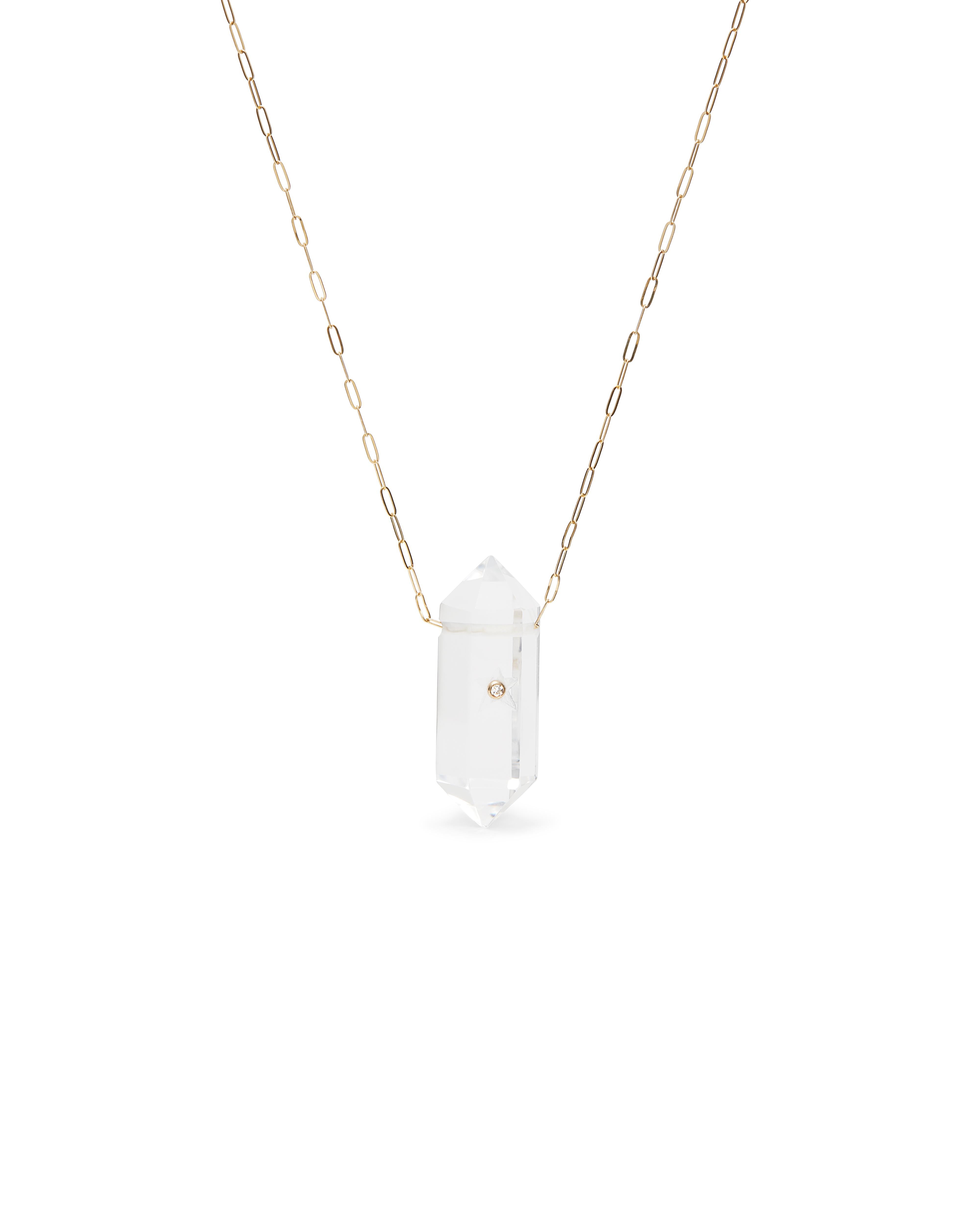 Mckenzie Liautaud 14 Kt Gold Rock Star Necklace 
14 kt Yellow Gold Paperclip necklace featuring a polished rock crystal pendant accented with a 2.3 mm white diamond set in a 14 kt yellow gold bezel and hand carved star.
Necklace measures 24