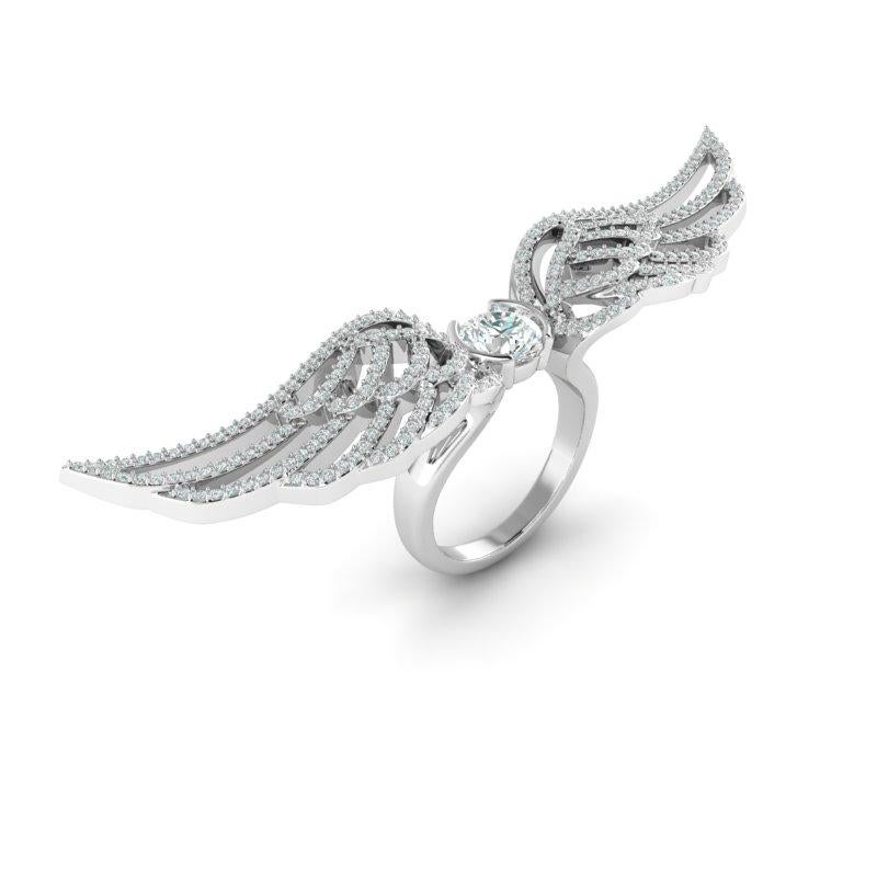 Mckenzie Liautaud 18 kt Wings of Love Ring 
18 kt White Gold Dramatic Winged Ring encrusted with sparkling round white diamonds Center Stone 1.02 Carat VS1 Sparkling White Diamond Total 2.04 Carats 