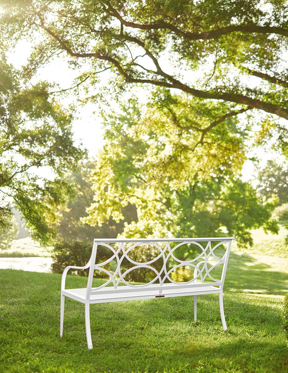 The McKinnon and Harris Three-Seater Virginia Bench with Keswick Back in Classic white finish. High performance outdoor aluminum furniture for estate, garden, and yacht. A bench is the foundational piece for a garden. Our Keswick back is a design of