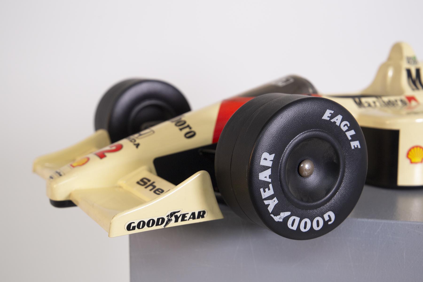 Rare McLaren racing car model in 1:8 scale. The model toy is the celebratory car for Ayrton Senna's 1988 world championship victory . The model is one of the rarest models because it is present the flag of Brazil. The model is Honda Mod. MP 4/4