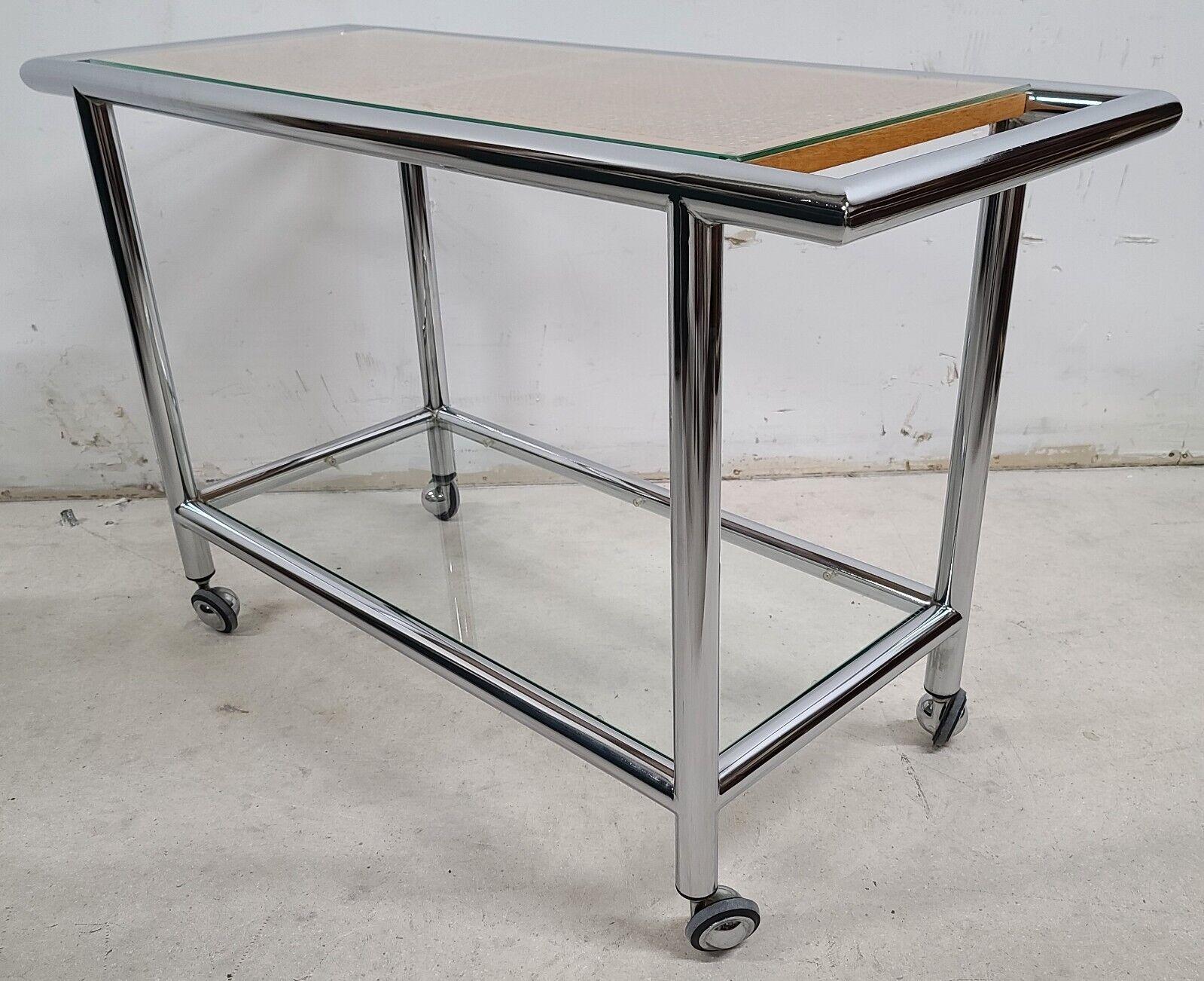For FULL item description be sure to click on CONTINUE READING at the bottom of this listing.

MCM 1970s Chrome Wicker Glass Rolling Bar Serving Cart
Featuring very high-quality chrome frame and chrome Shepard Casters

Approximate Measurements in