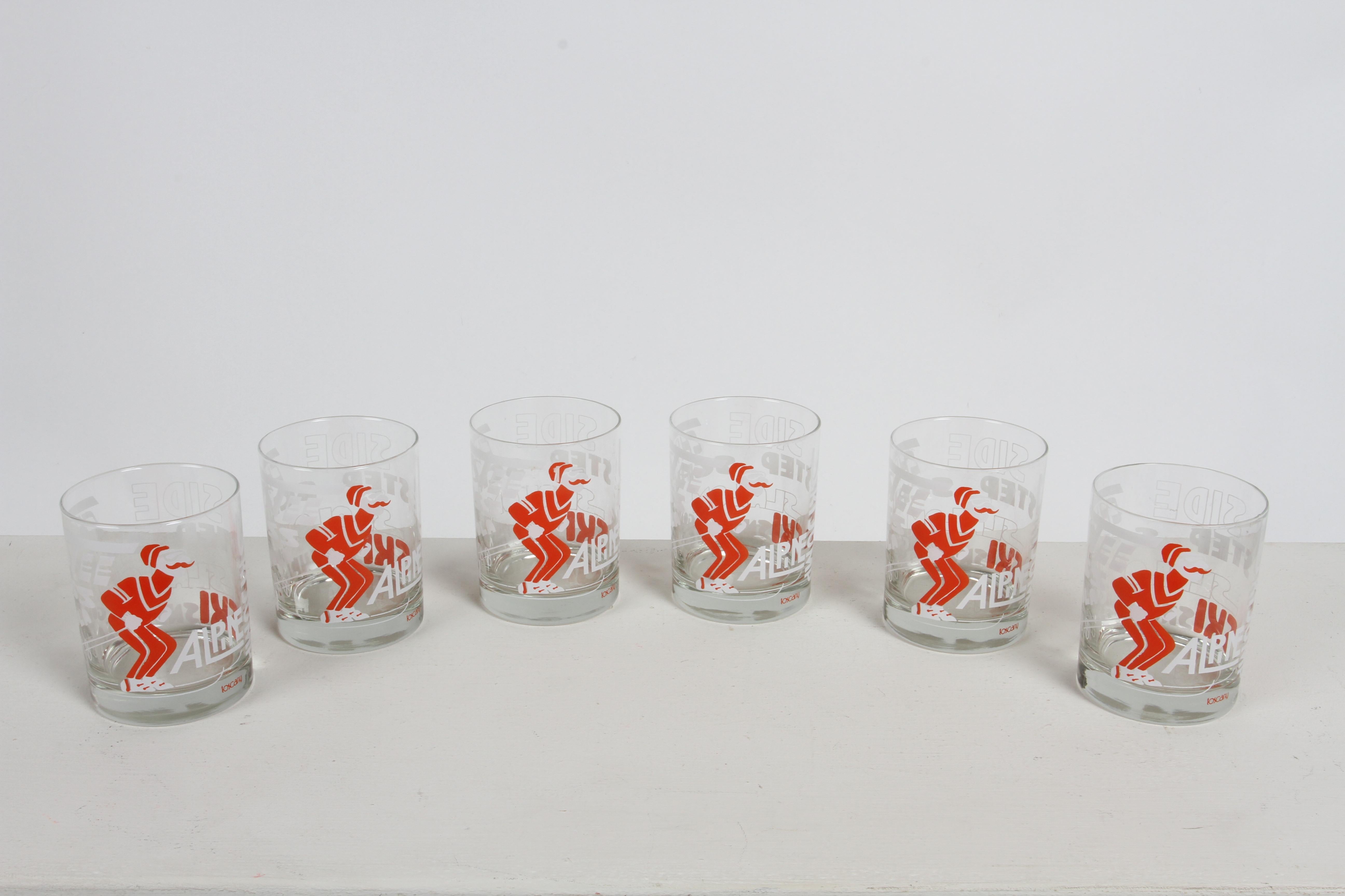 Vintage 1970s NOS (New Old Stock) set of 6 Ski - Winter theme barware rocks glasses by Toscany. Printed in Red and White Ink, with a retro skier and words like Alpine, Christie, Schuss, Gonoda, Snowplow, Slalom, Sidesteps, Ski Jump. Removed vintage