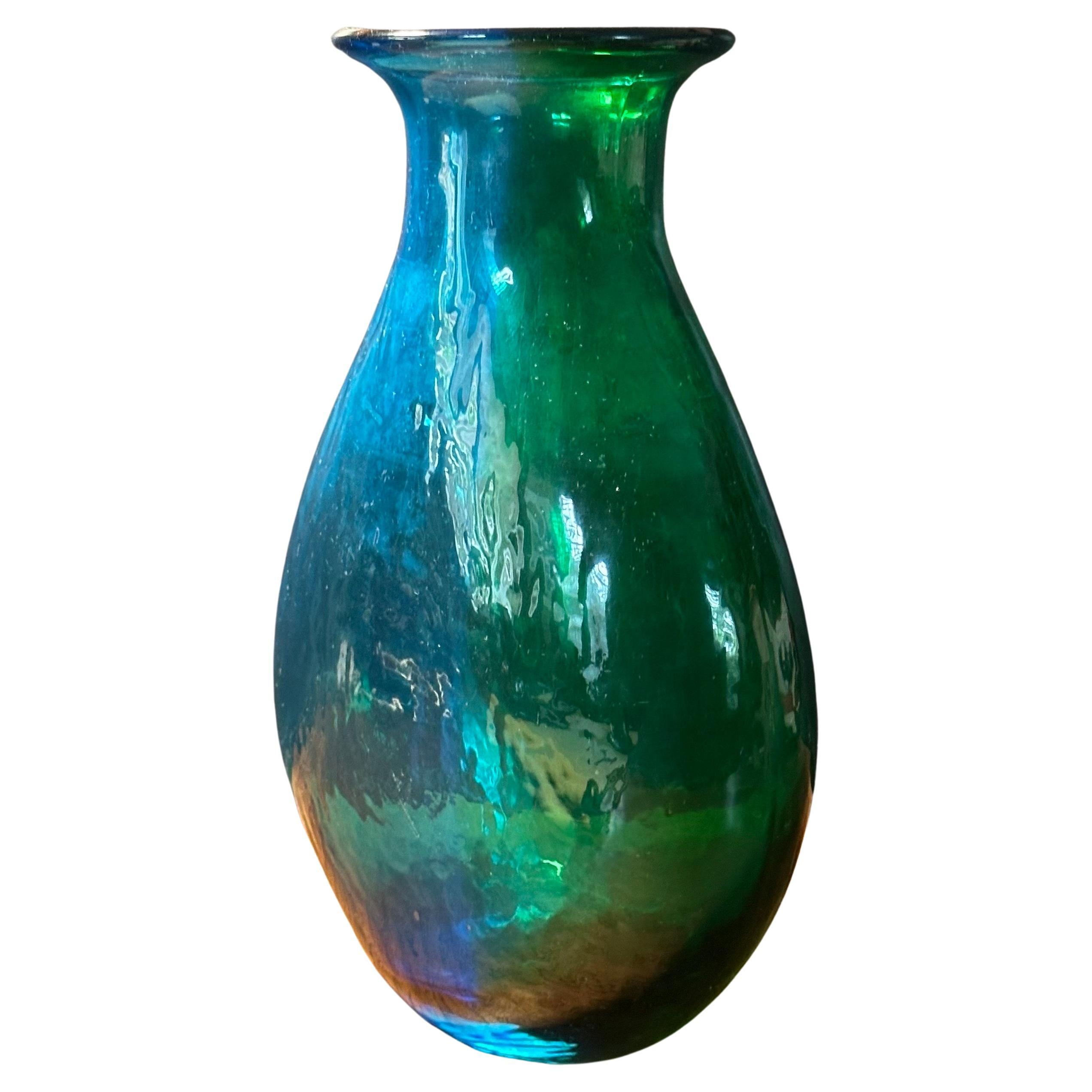 A beautiful MCM art glass vase with a green / blue translucent finish, circa 1970s.  The vase is in very good vintage condition with no chips or cracks and measures 6.75