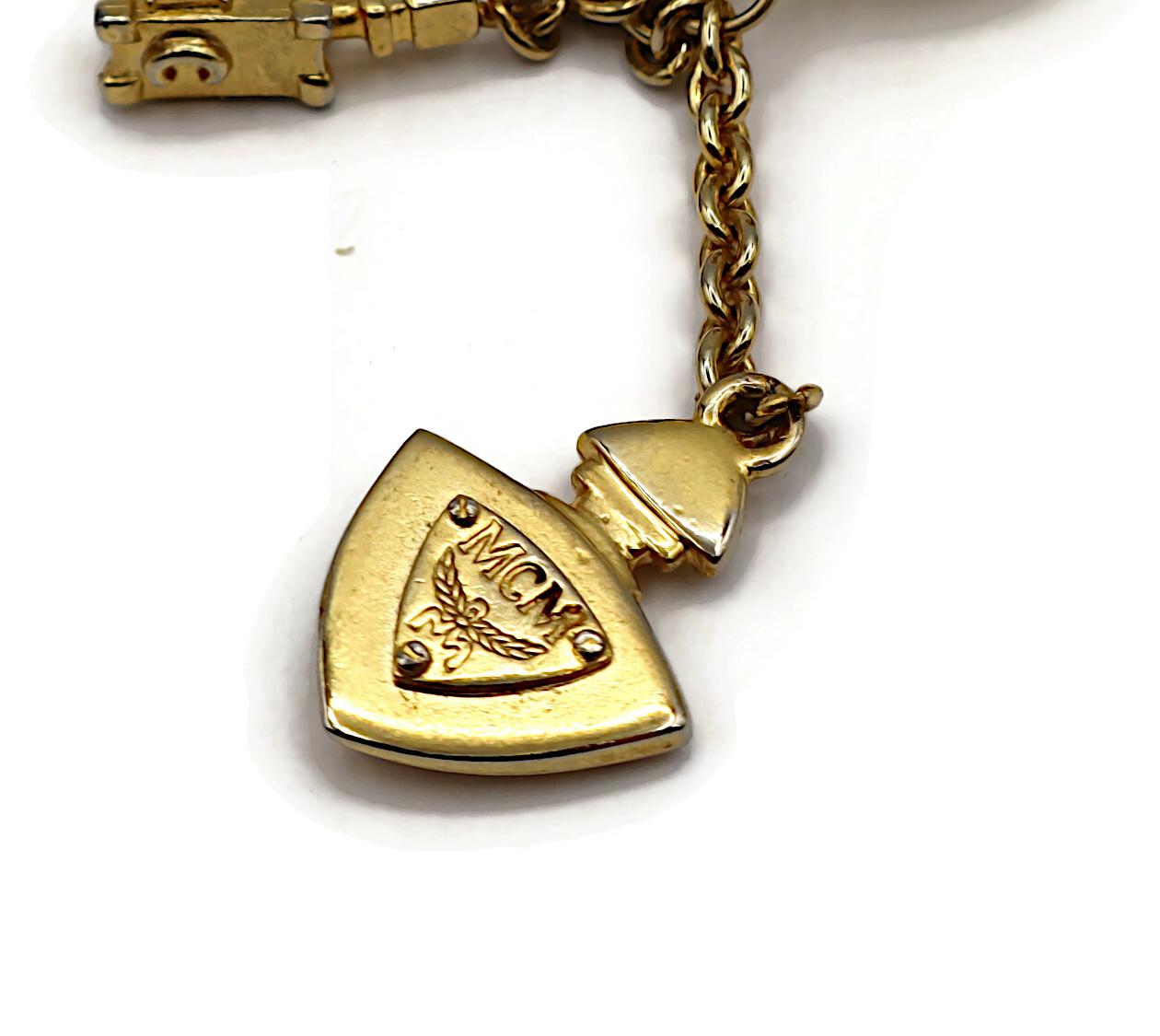 MCM (Atribuido a) Pendientes colgantes con dijes vintage en tono dorado en venta 12
