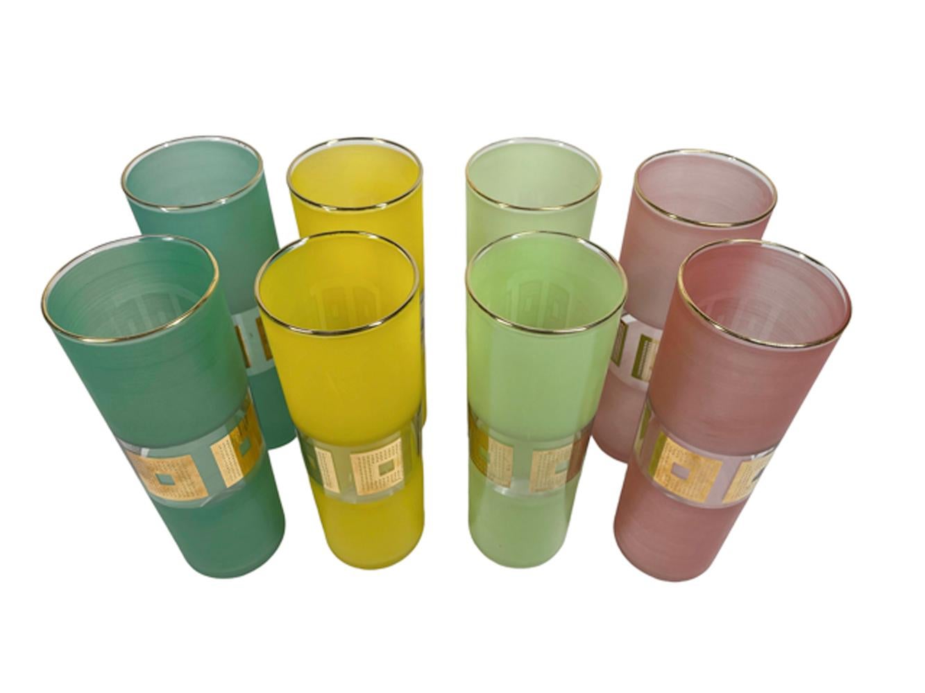Eight mid-century modern Tom Collins glasses by Bartlett-Collins with frosted sides in 2 each of teal, yellow, pink and lime. Each glass with a clear reserve in the middle with squares of 22 karat gold with a grid pattern around a central open