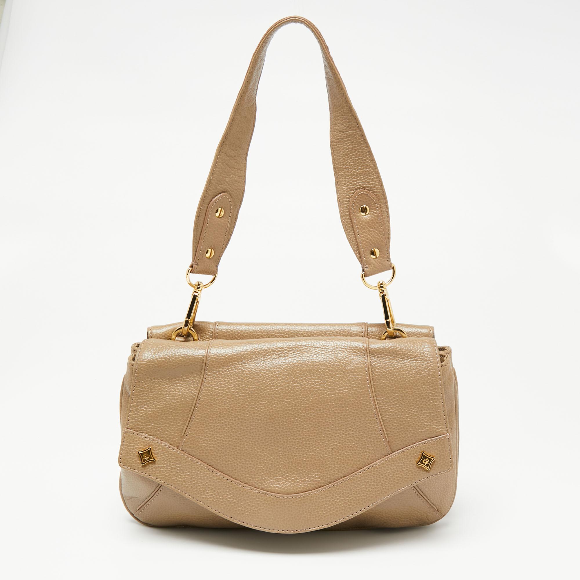 This shoulder bag from MCM is crafted from beige leather. The bag features House code studs, a double-sided flap closure, a shoulder handle, and a fabric-lined interior. This creation is easy to carry on any day.

Includes: Detachable Strap