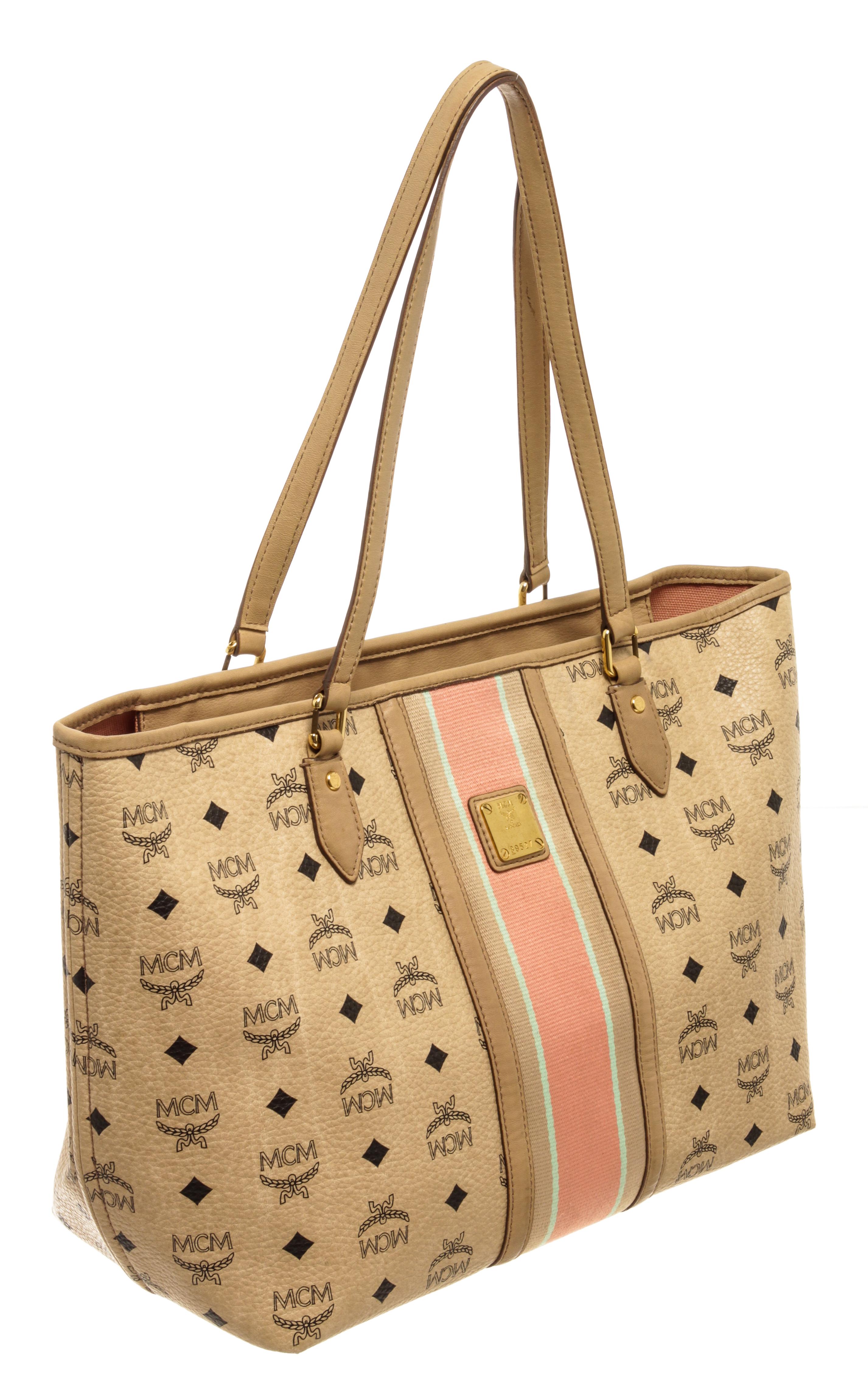 MCM Visetos Striped Tote Beige with this sophisticated tote is finely crafted of coated canvas in beige and with the classic black mcm monogram print, matching beige leather top handles with gold hardware, and a pink and mint green stripe down the