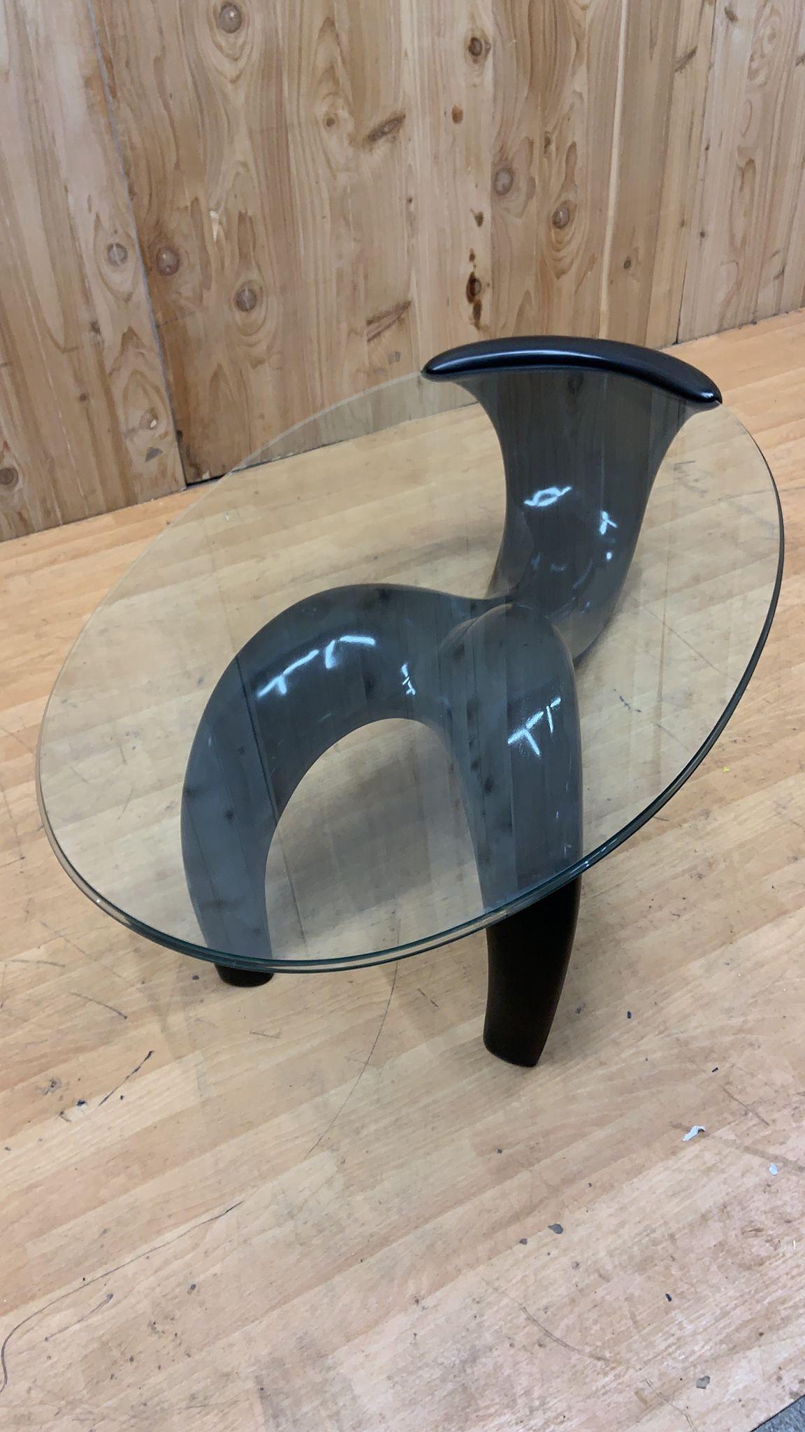 Mid Century Modern Black Abstract Fiberglass Sculptural Base Oval Glass Top Coffee Table

This mid century modern abstract black table is going to be a speaking point in any room that it is featured in. The base is constructed of fiberglass and the