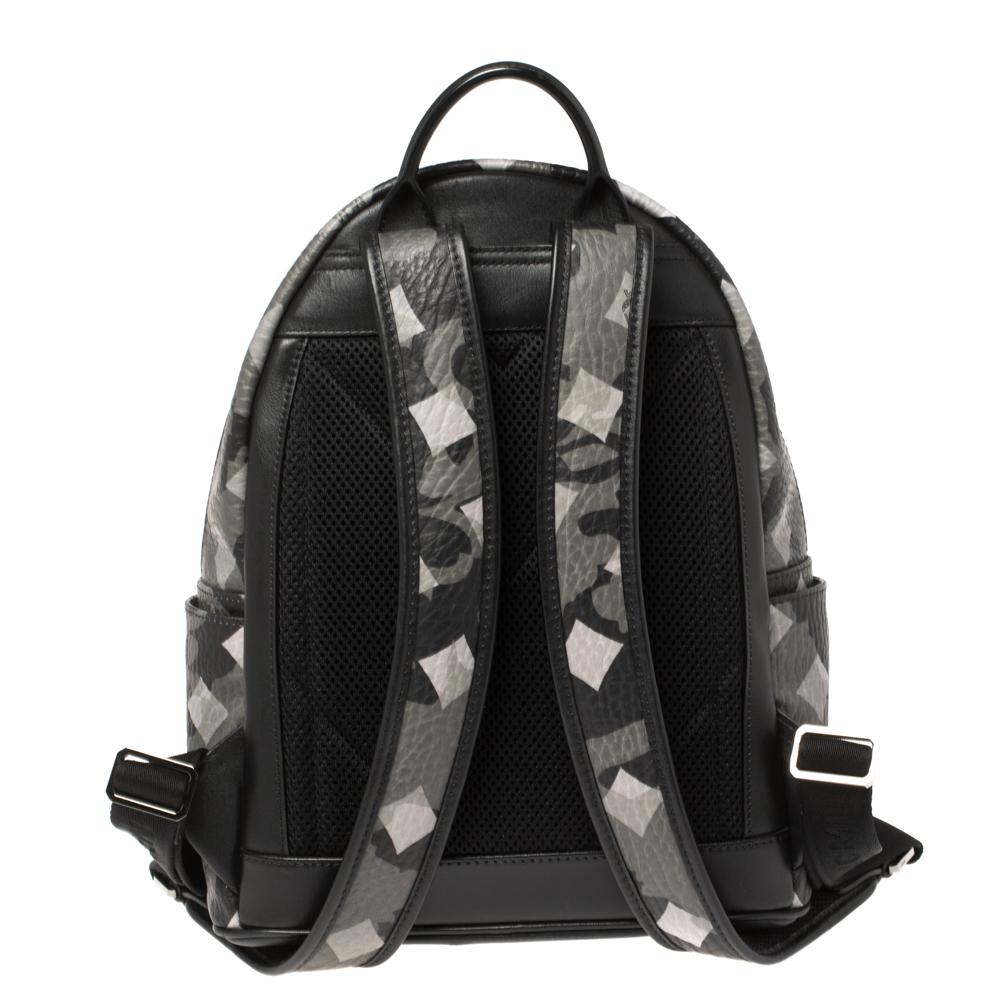 The Munich Lion is an interpretation of a military classic featuring tarot diamonds symbolizing value, strength, and durability. Made from coated canvas and leather, it comes with a two-way zip-around top closure, a front zip pocket with pyramid