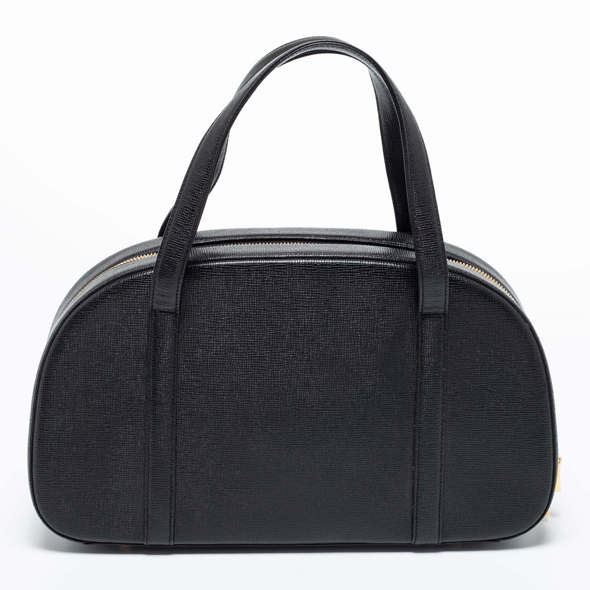 Simple details, high quality, and everyday convenience mark this bag by MCM. The bag is made of black leather and it features dual handles, gold-tone metal accents, and a spacious interior.

Includes: Original Dustbag