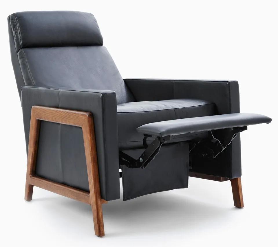 For FULL item description click on CONTINUE READING at the bottom of this page.

Offering One Of Our Recent Palm Beach Estate Fine Furniture Acquisitions Of A
MCM Black Leather Recliner Spencer by West Elm
Featuring a Walnut frame and Black Sauvage