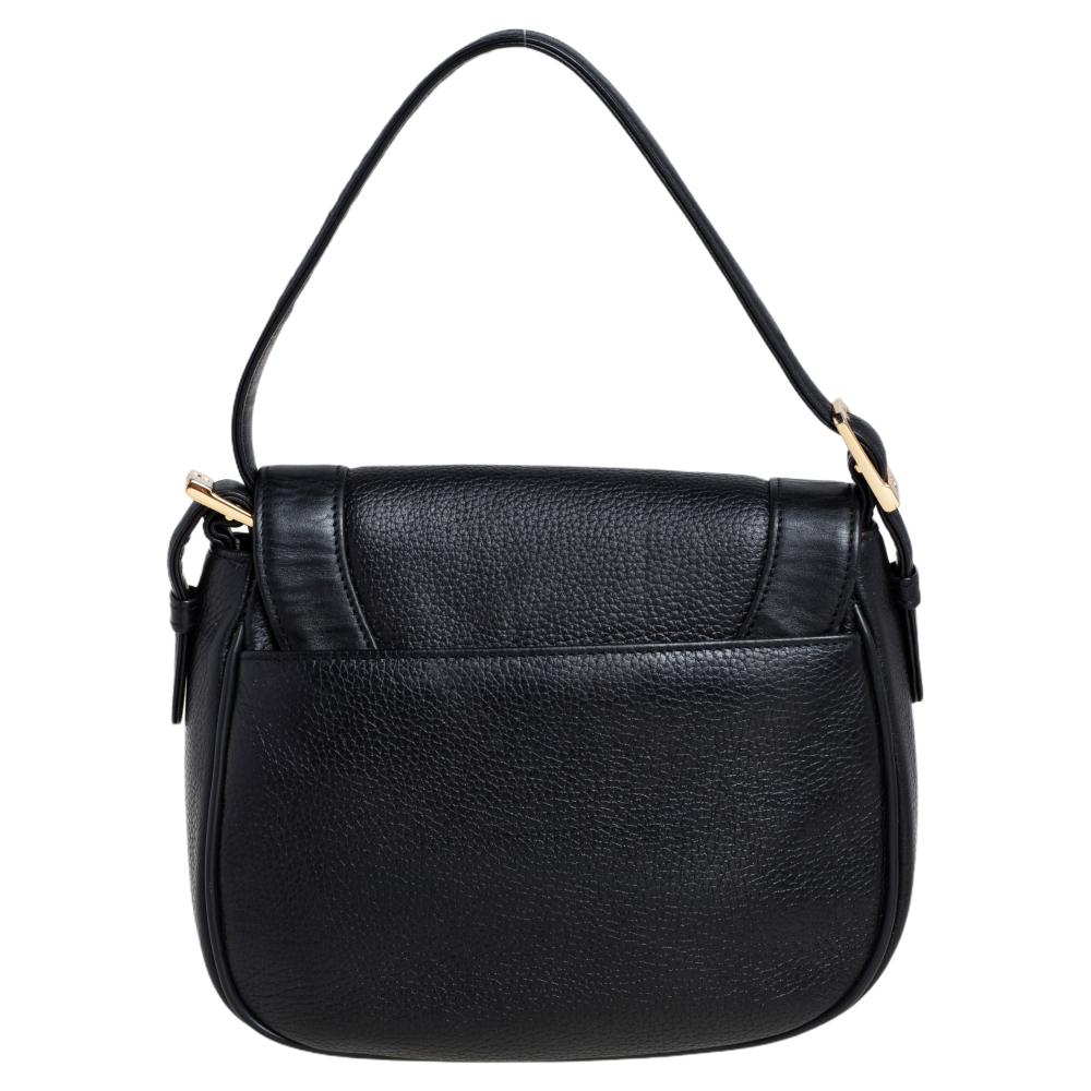 This bag is a delighting creation by MCM. Crafted from leather, the bag features a black shade, stud embellishments and the brand label on the front flap, and a fabric-lined interior sized perfectly to hold your essentials. It is complete with a