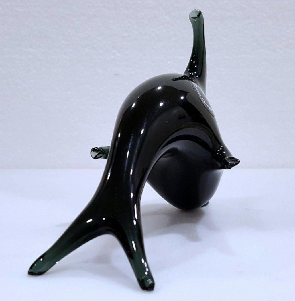 Black Murano Glass Dolphin by V. Nason, Italy, with Original Label 
UPDATE: Due to agreement with 1stDibs, we'll be staying through the end of the year.
This handsome black dolphin is in nice vintage condition and measures approximately 5.25 x 4