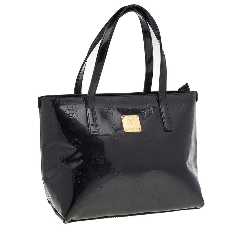 This tote from MCM will assist you greatly. This tote is designed using black embossed patent leather with a gold-toned logo plaque attached to the front. This tote is held by two top handles, which makes it easy to carry around.