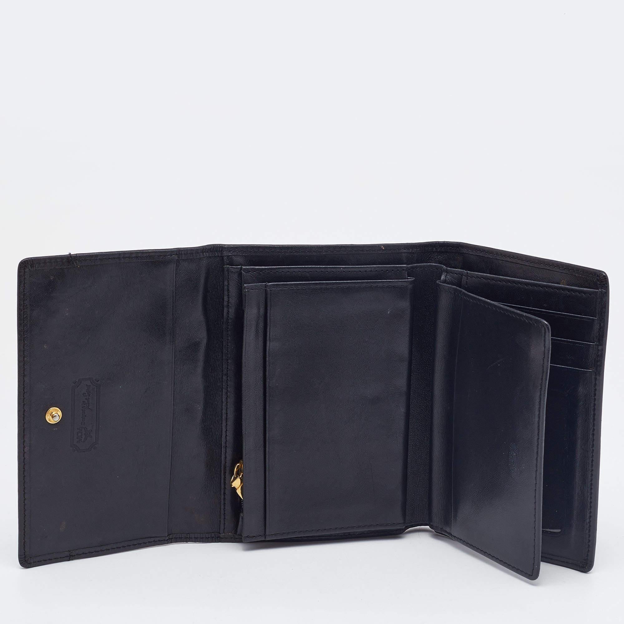 This small but functional wallet from MCM has been expertly designed in a silhouette that can neatly organize all your essentials. It features card slots  a zipper pouch to hold coins  and slots to keep your currency. It can easily be carried
