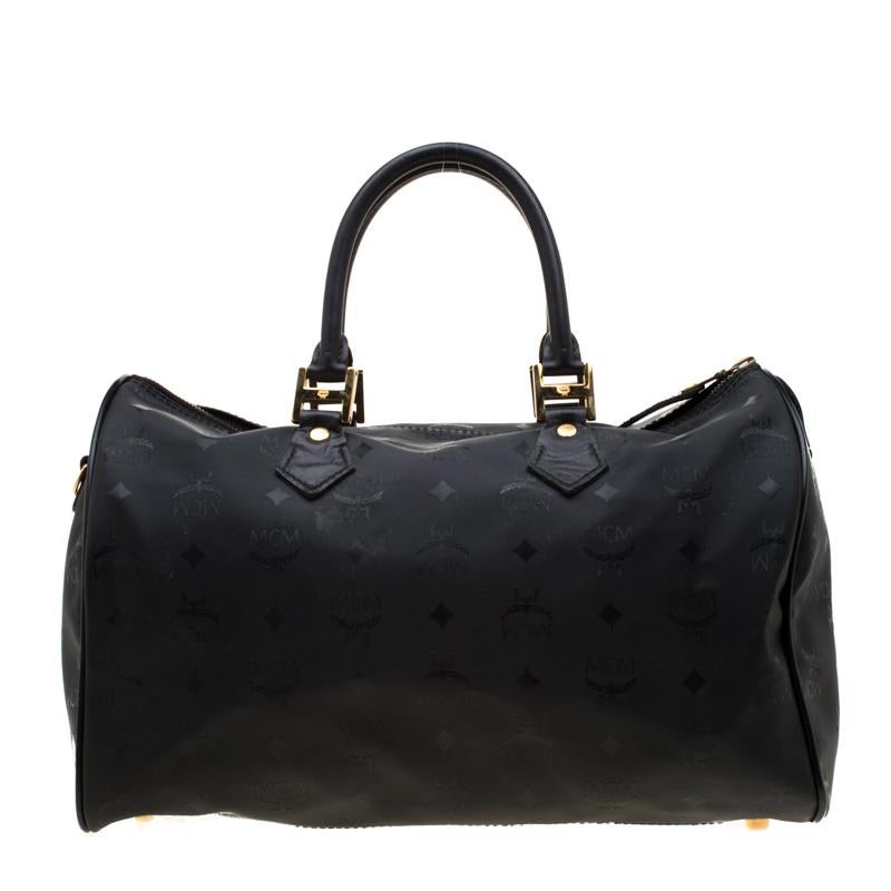 Add some magic to your outfit with this elegant handbag in black. Skillfully made from Signature Visetos nylon with leather handles, it can easily hold more than just essentials. This MCM creation is perfect for almost all the occasions that you