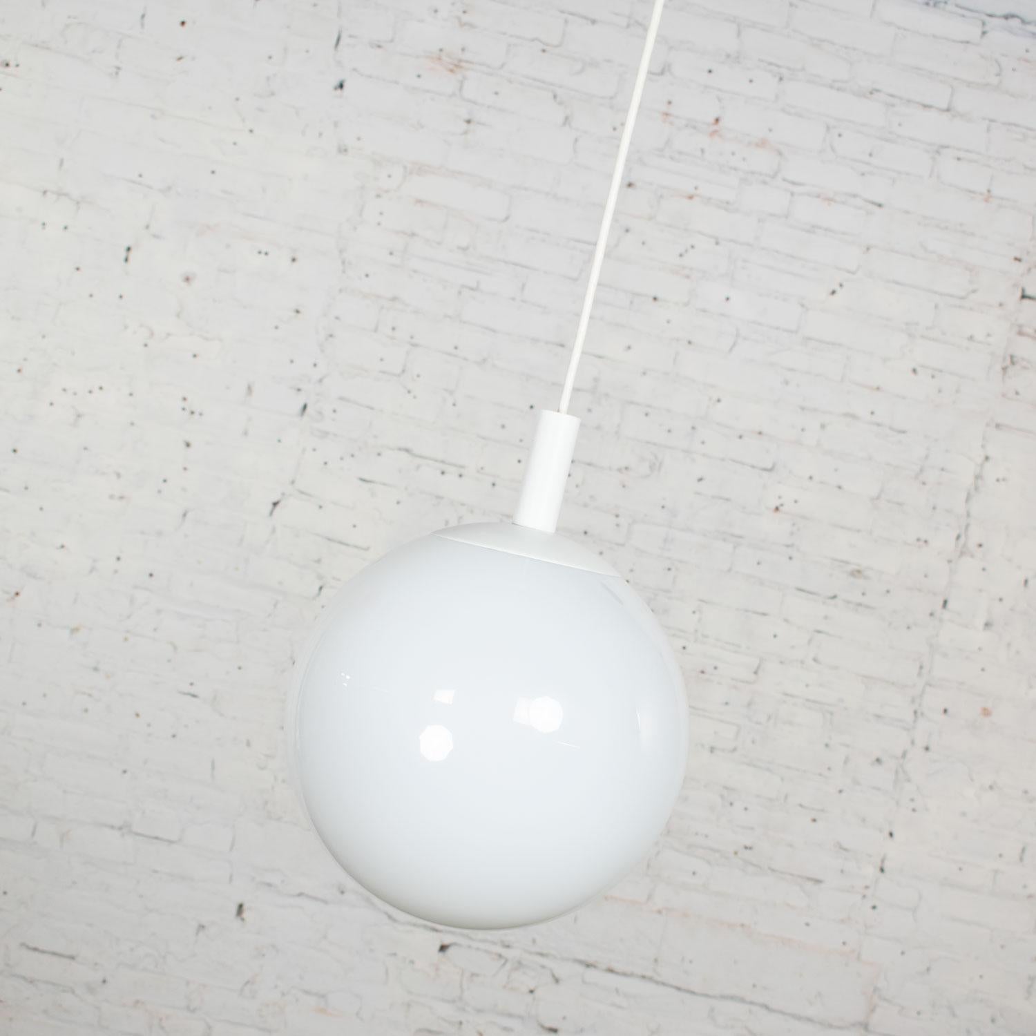 Gorgeous Lite Trend of La Palma, California vintage blown milk glass large globe pendant light 15 ft. hanging cord. Wonderful vintage condition. No flaws detected. Please see photos, circa 1960s.
Note- 16 feet of adjustable cord with clips to swag.