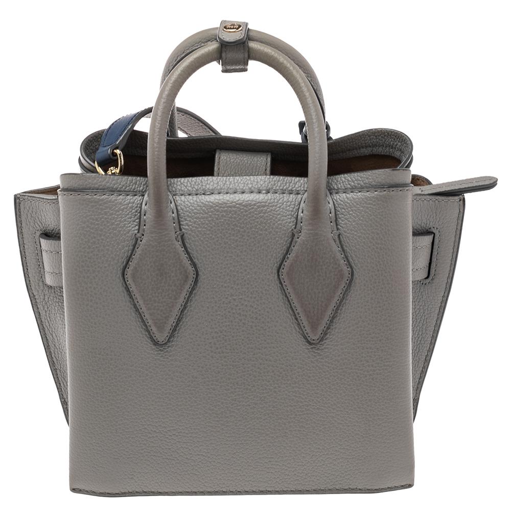 This chic Milla tote by MCM will surely meet all your expectations. Crafted to a smooth finish, this leather bag comes in two subtle hues. Lined with suede, its interior is as durable and functional as the exterior. This elegant tote is finished
