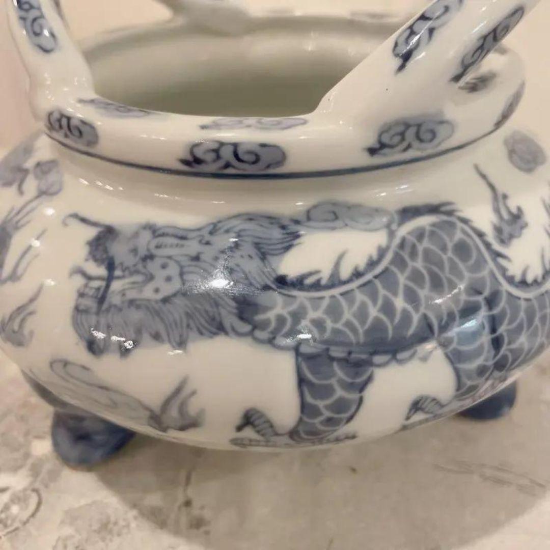 Vintage Blue and White Asian Incense Burner Pot, Tripod Chinese Pot with Dragon Motif and Handles, Chinoiserie Dragon Porcelain.  Blue and white porcelain incense burner three footed bowl with two handles in very nice condition. Features a pair of