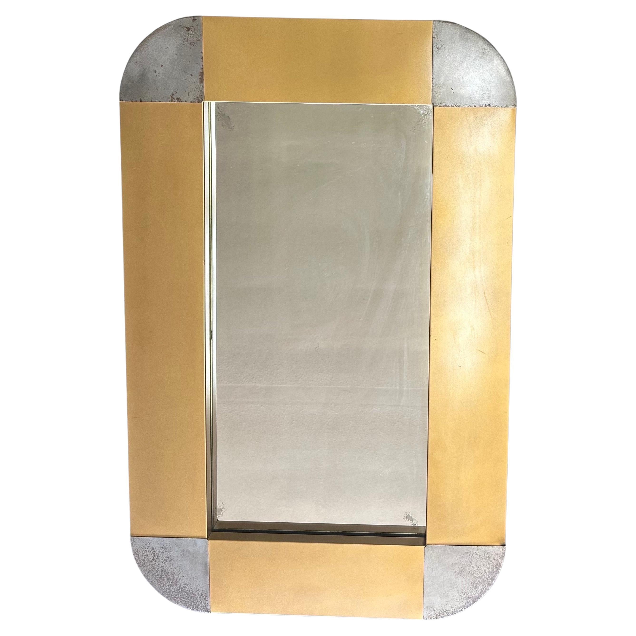 Beautiful and rare MCM brass and steel rectangle wall mirror by Curtis Jere for Artisian House, circa 1970s.  The piece is in good vintage condition with a wonderful patina to the brass and the steel.  The mirror can be hung either horizontal or