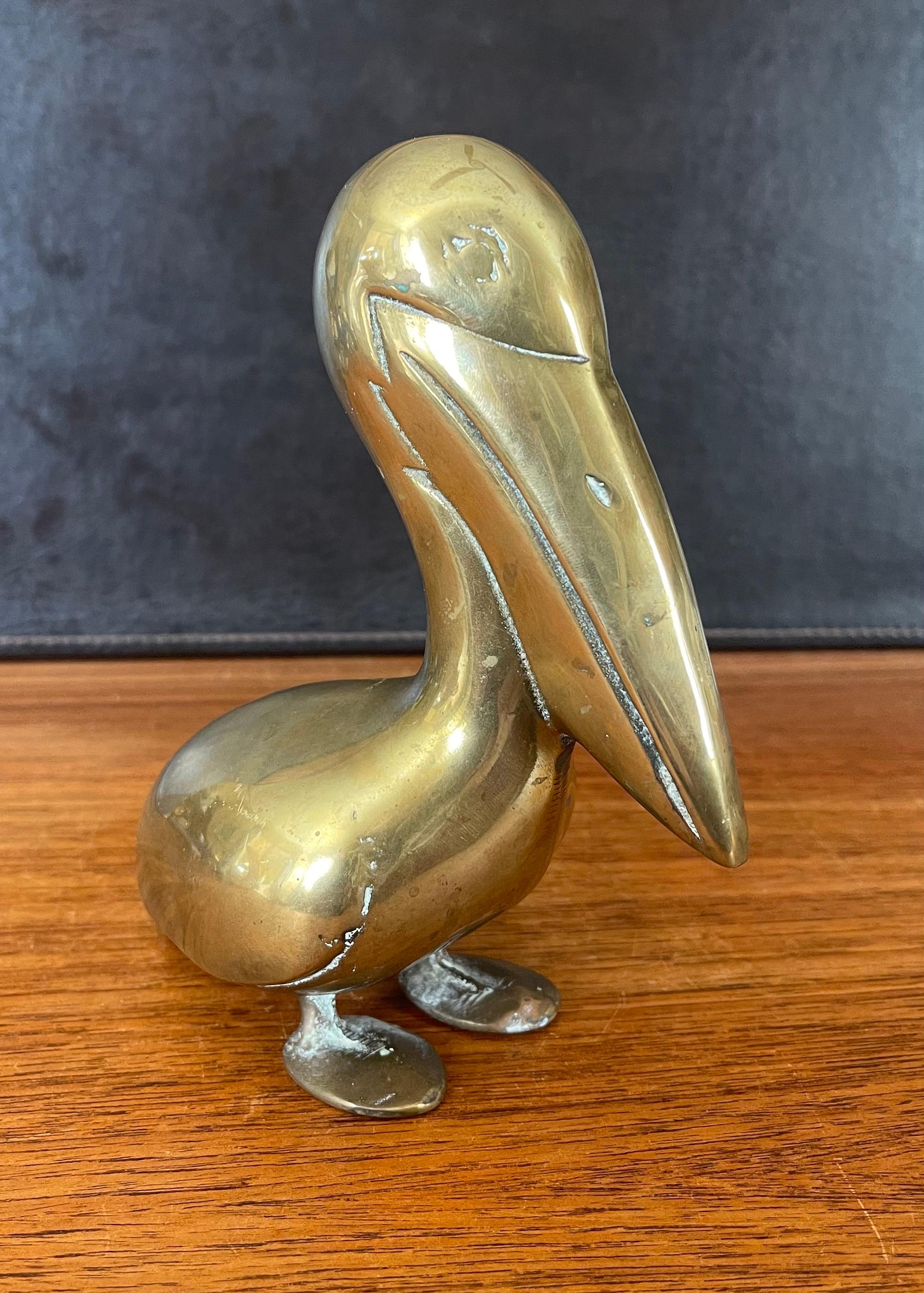 A very cool modernist brass pelican sculpture with a gorgeous natural patina, circa 1970s. The piece is in very good vintage condition and measures 4