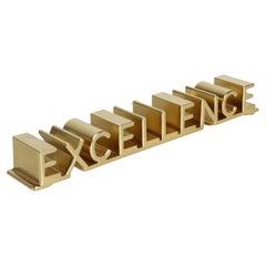 MCM Bruce Fox Gold Anodized Aluminum 3D "Excellence" Motivation Desk Accessory 
