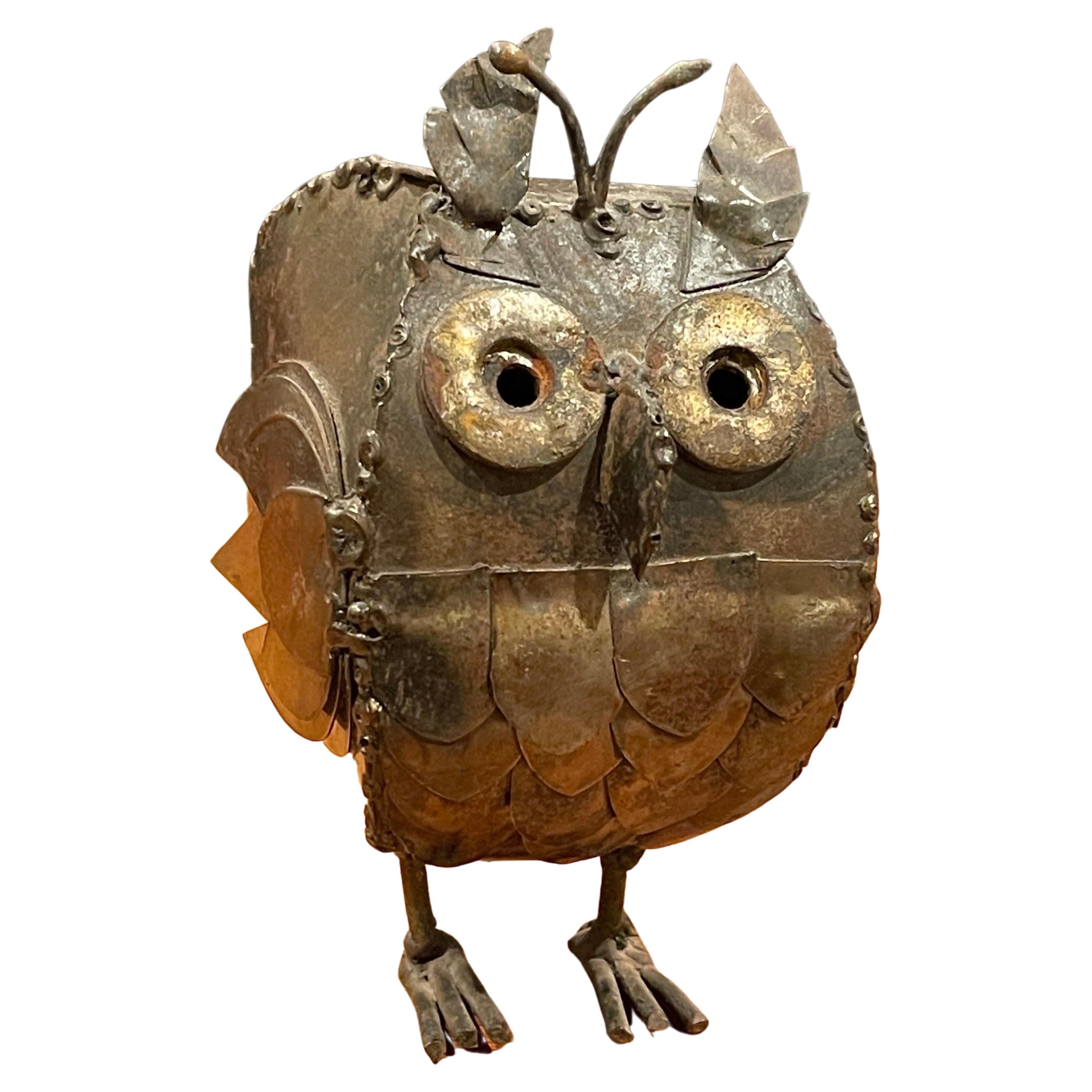 A very cool midcentury Brutalist owl sculpture, circa 1970s. The piece is made of raw welded sheet metal with a wonderful vintage patina and measures 3.25