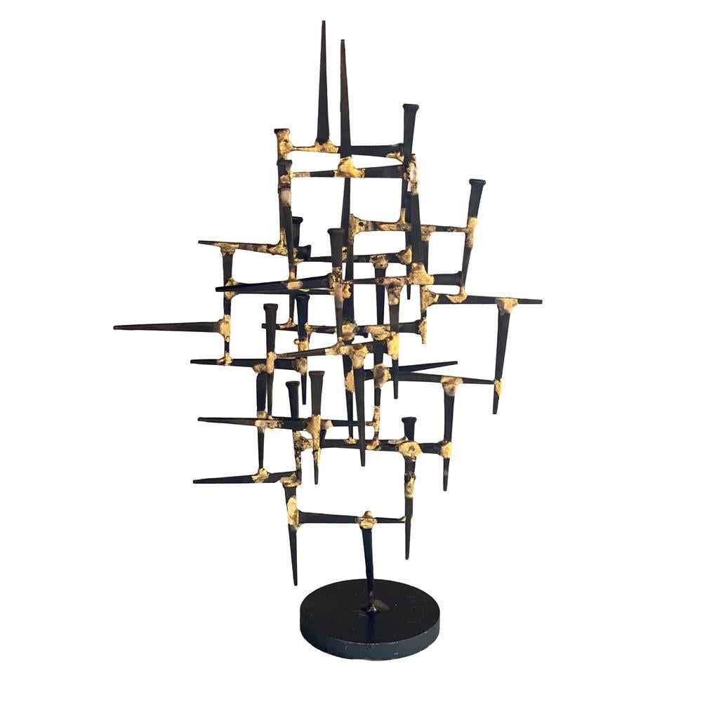 Handmade late modern era welded nail sculpture with 3 layers of welded panels of welded iron nails giving it a 3d look.  It is welded together using brass with older heat-treated iron nails.

The sculpture easily holds jewelry and watches along the